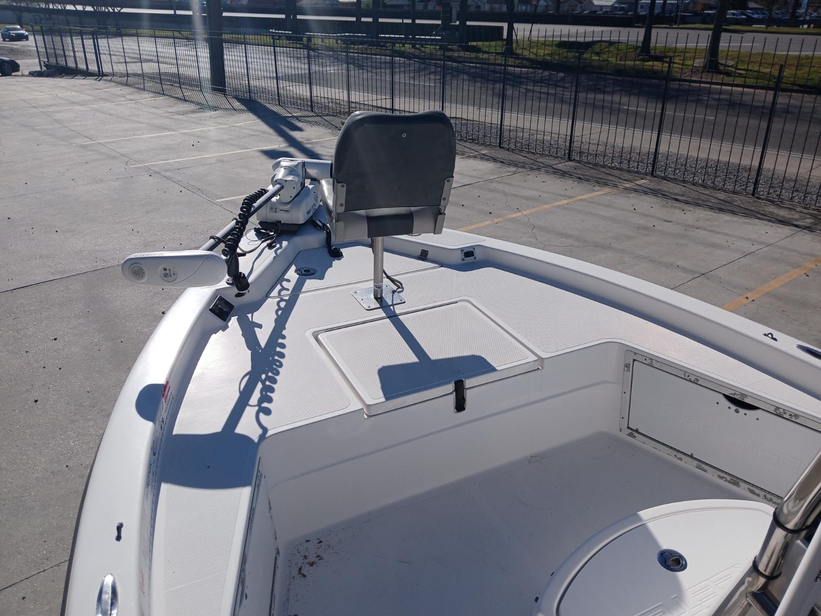 2008 Skeeter 20 ZX boat deck with seating and trolling motor in a parking area.