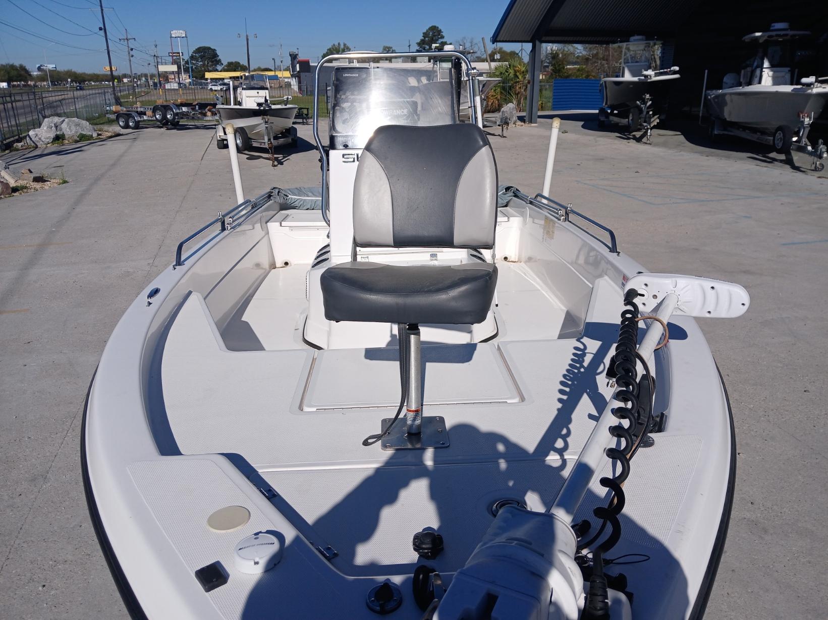 2008 Skeeter 20 ZX boat with seating and motor, parked outdoors on a sunny day.