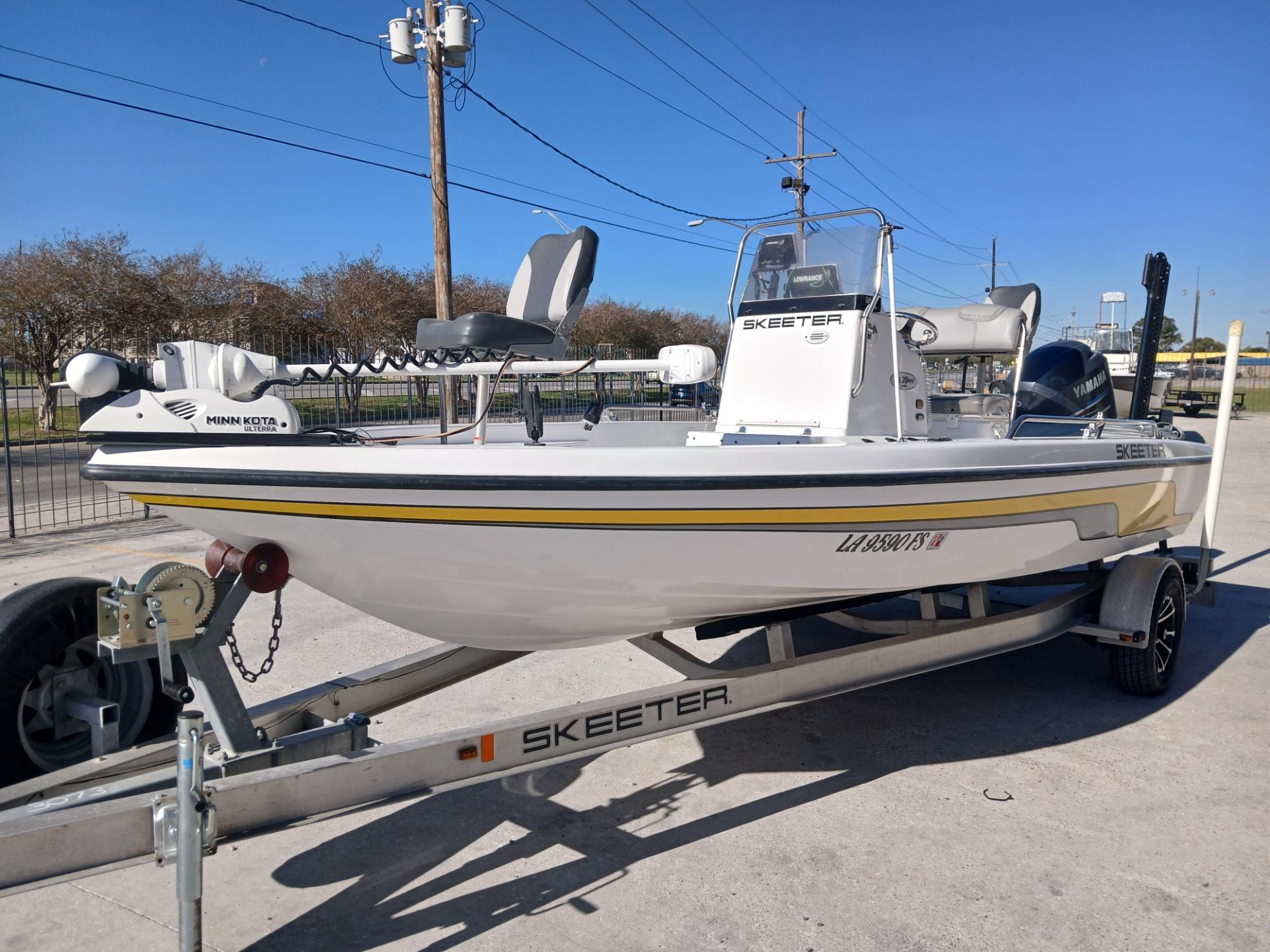 2008 Skeeter 20 ZX fishing boat on trailer, parked outdoors.