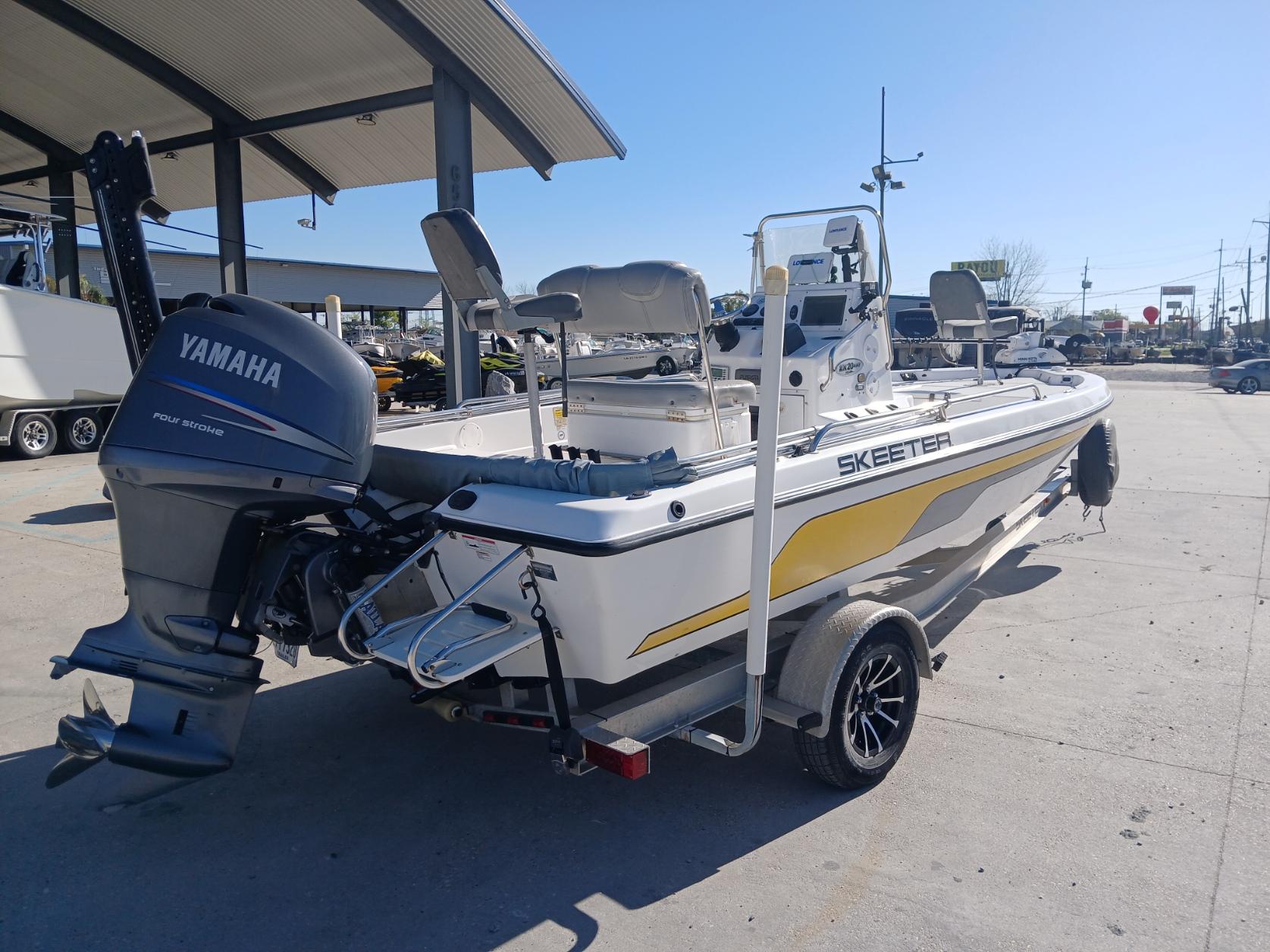 2008 Skeeter 20 ZX boat with Yamaha outboard motor, parked outdoors.