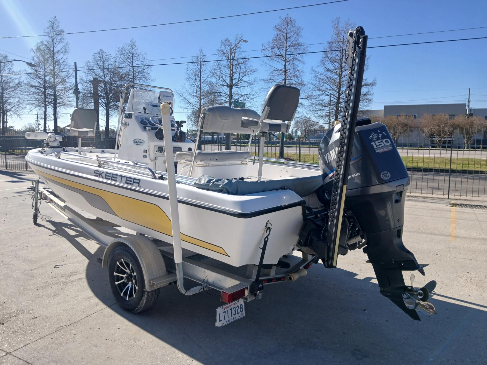 2008 Skeeter 20 ZX boat with Yamaha 150 engine, parked on a trailer.