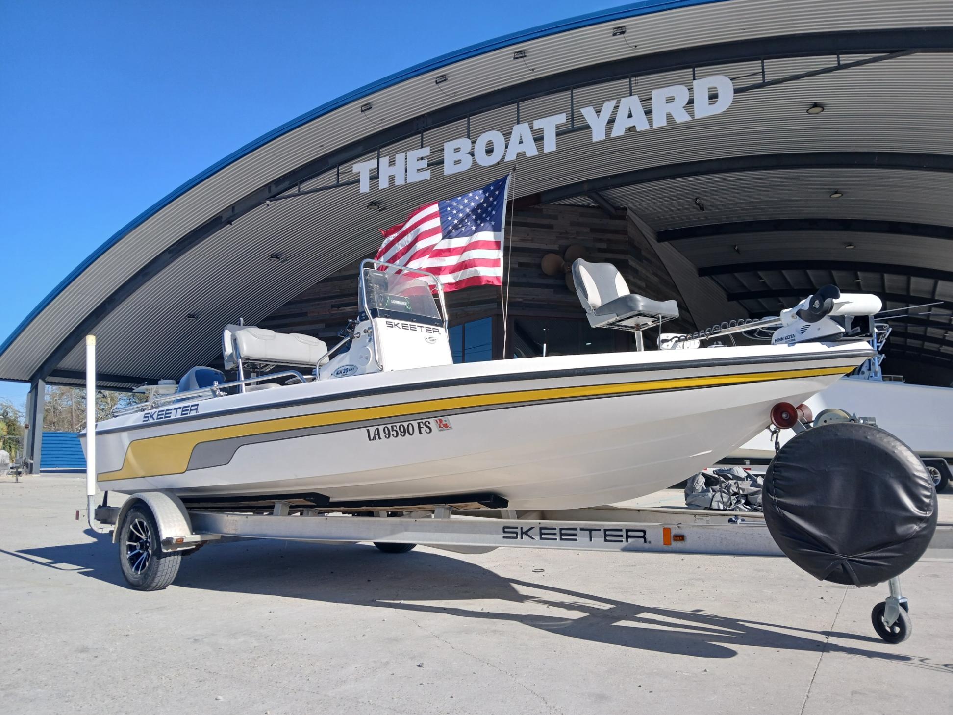 2008 Skeeter 20 ZX boat on trailer at The Boat Yard, featuring an American flag.
