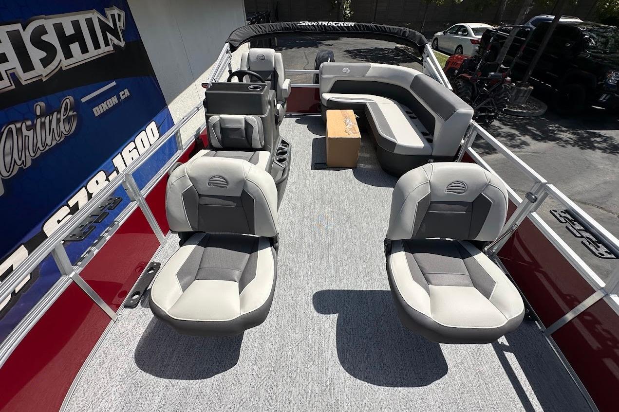 2026 Sun Tracker Bass Buggy 16 XL Select pontoon boat interior with seating and helm.
