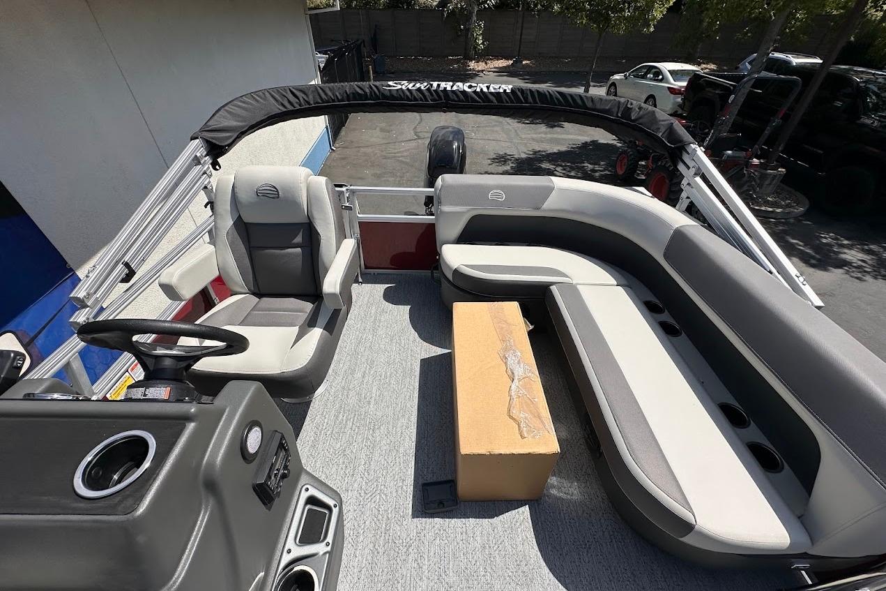 2026 Sun Tracker Bass Buggy 16 XL Select interior with seating and steering console.