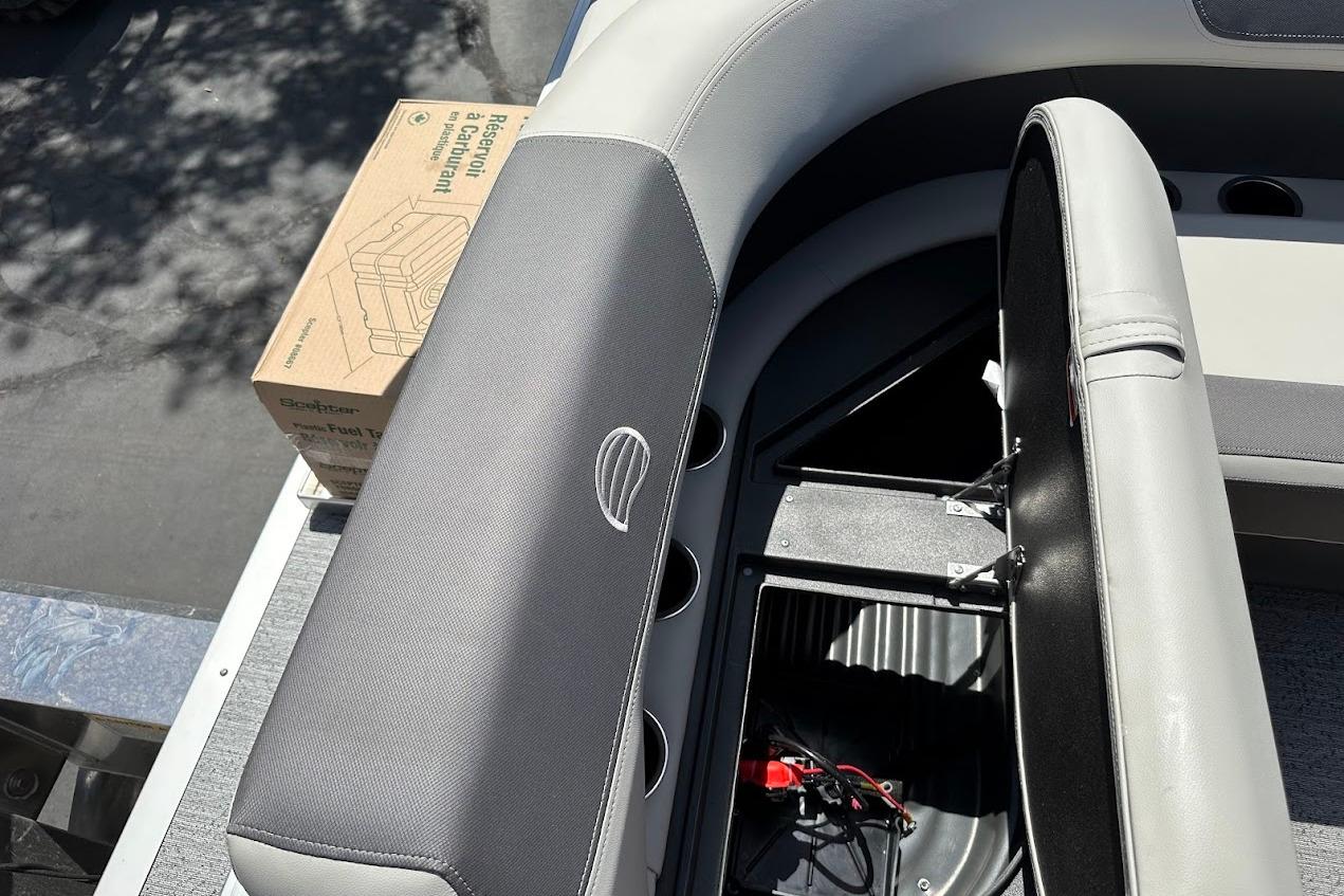 2026 Sun Tracker Bass Buggy 16 XL Select boat interior with storage compartment and fuel tank box.