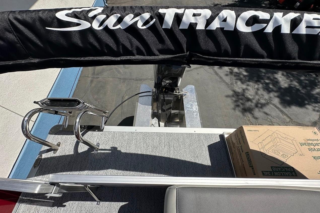 2026 Sun Tracker Bass Buggy 16 XL Select boat deck with accessories and packaging.