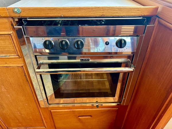 Stainless steel oven in a 1994 Grand Banks 42 Classic yacht kitchen.