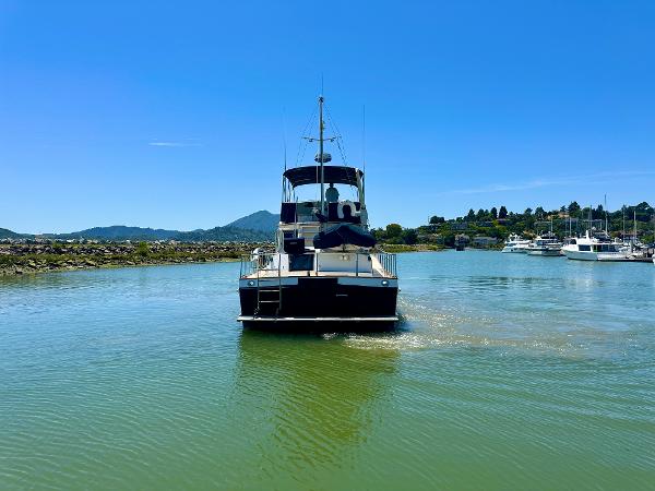 Grand Banks 42 Classic yacht cruising on a sunny day, 1994 model.