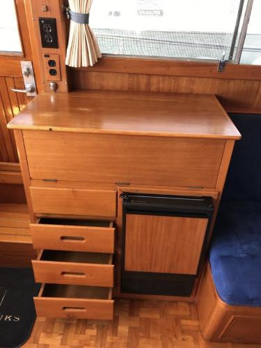 1994 Grand Banks 42 Classic interior with wooden cabinetry and drawers.