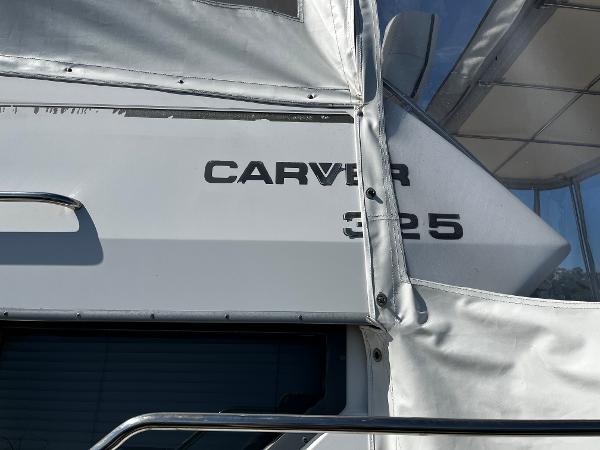 1996 Carver 325 Aft Cabin boat with white exterior and visible branding.