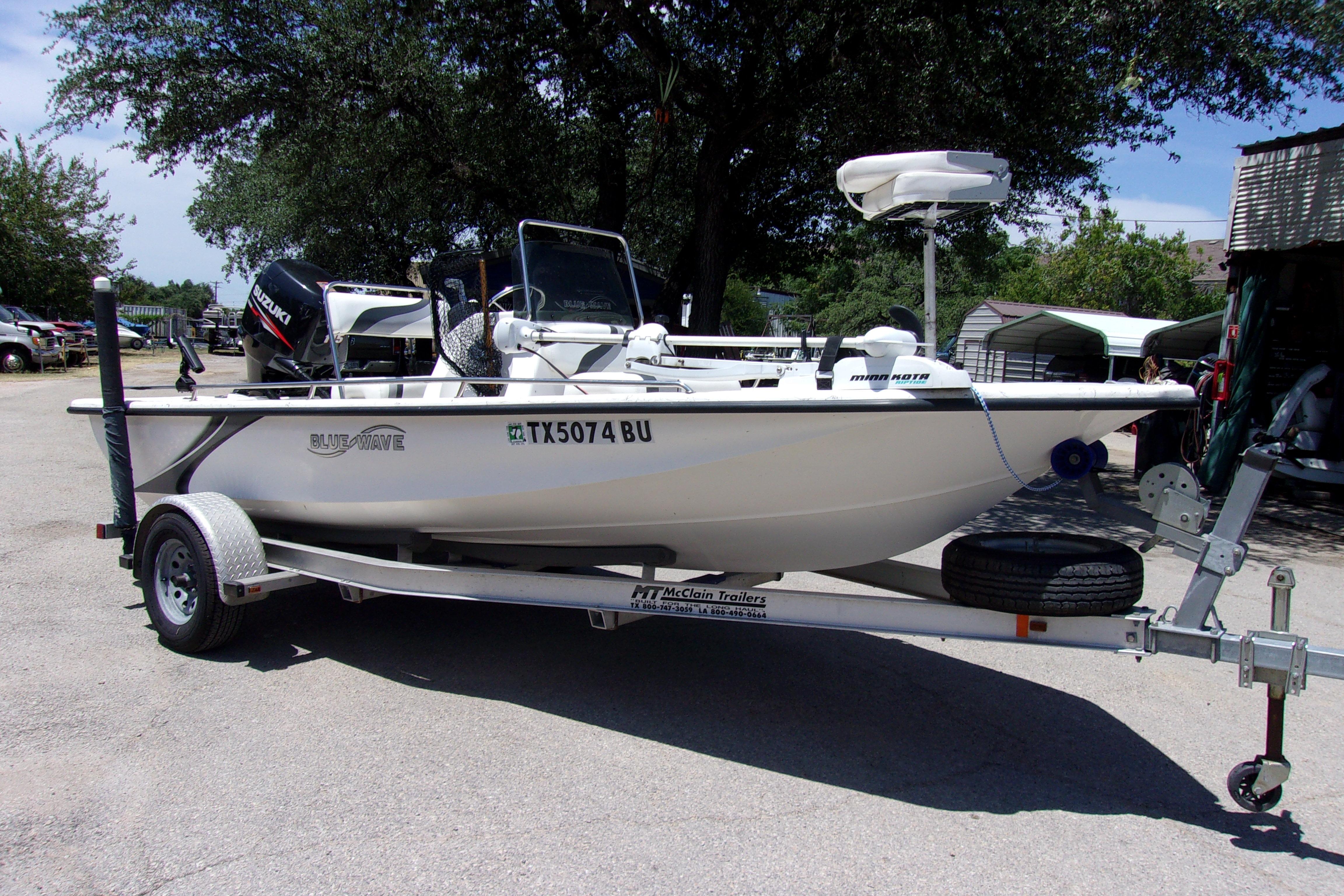 2011 Blue Wave 180 Super Tunnel boat on trailer, parked outdoors.