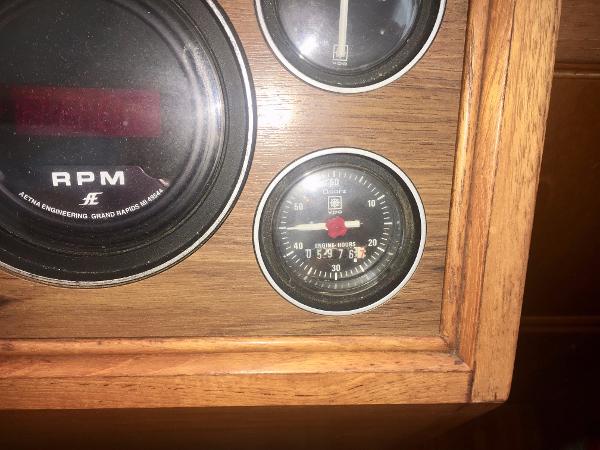 1982 Grand Banks Classic dashboard with RPM and engine hours gauges.