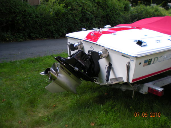 Rear view of a 2008 Donzi 18 Classic boat on grass.