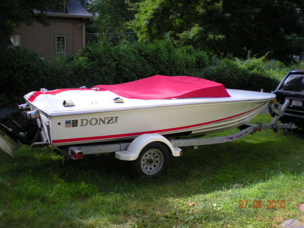 2008 Donzi 18 Classic boat with red cover on trailer.