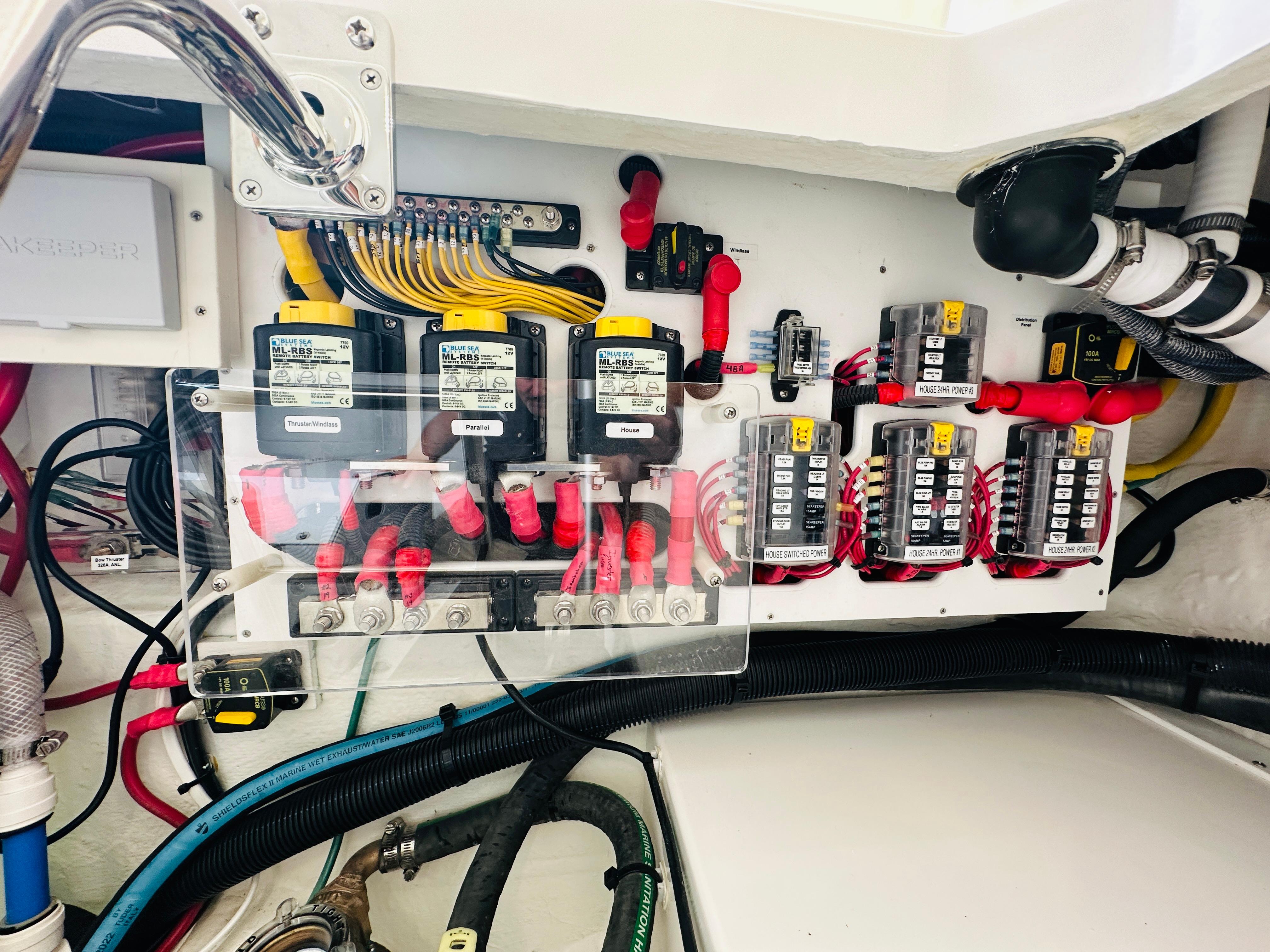 Electrical panel of 2023 Back Cove 34O boat, featuring wiring and circuit breakers.