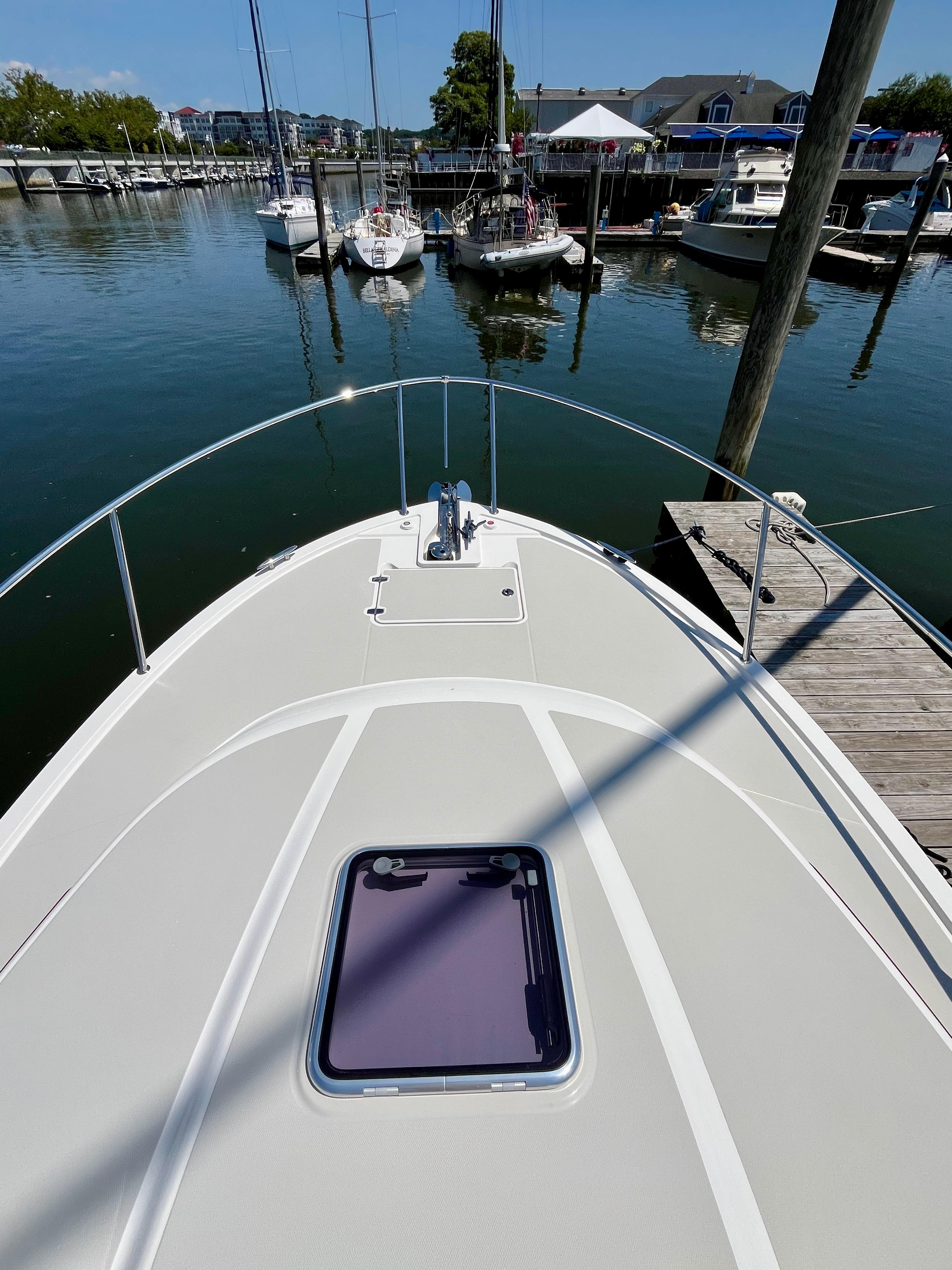 2023 Back Cove 34O boat docked at marina, view from bow.