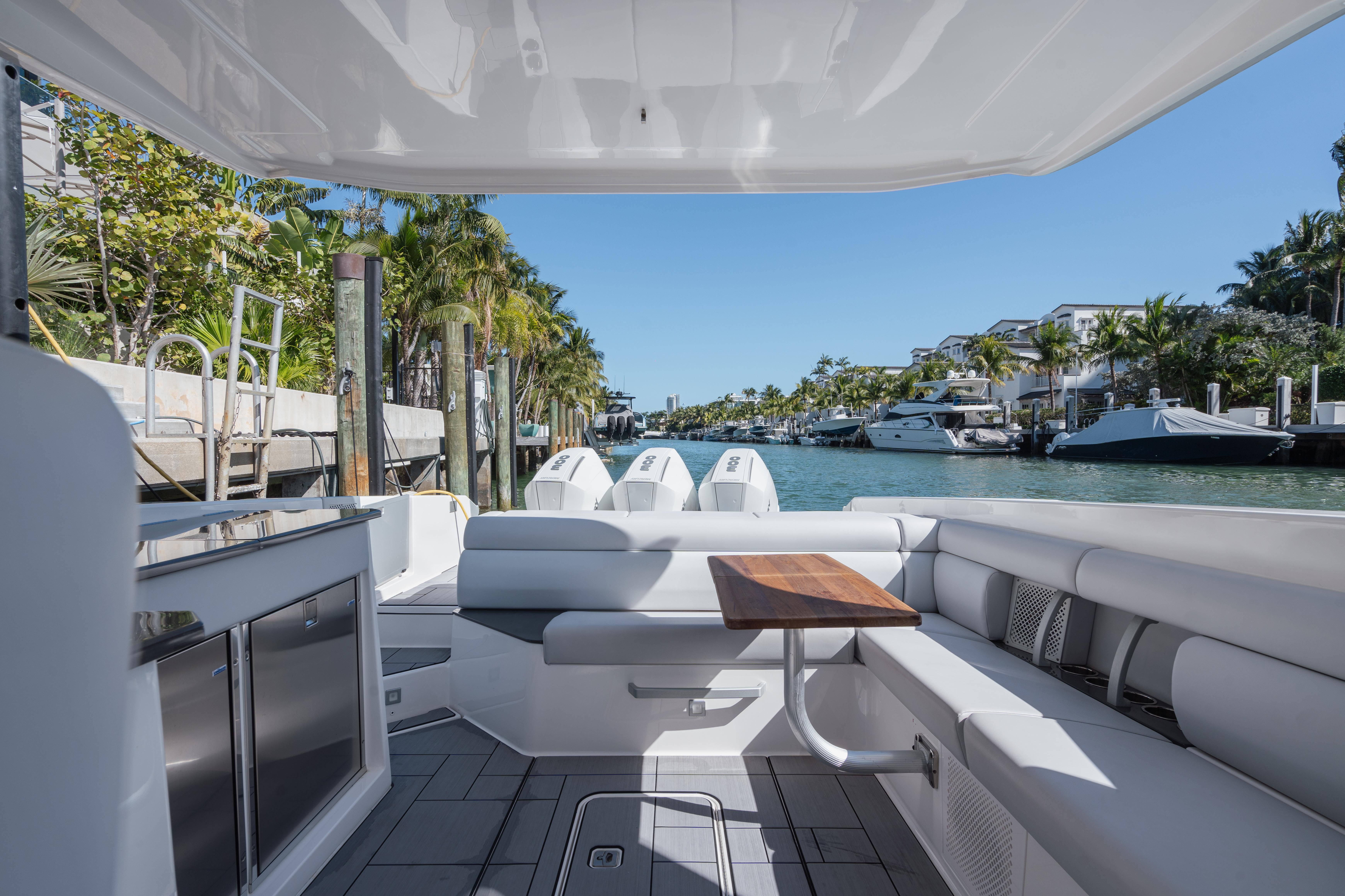 Aviara-AV36 OB 2023-Pellicano FL-US-2023 Aviara AV36 OB luxury boat interior with sleek seating and scenic waterfront view.-9680430