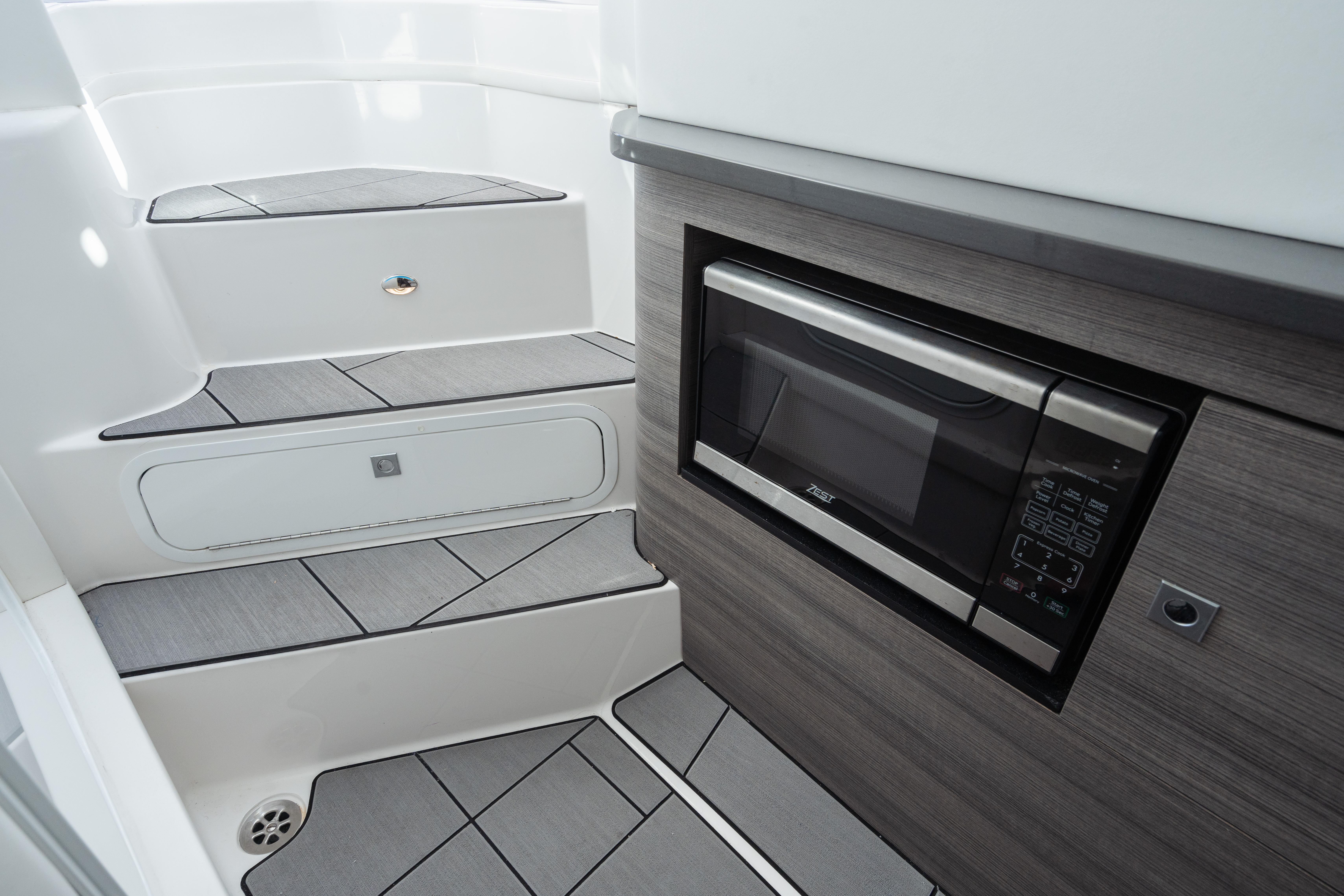 Aviara-AV36 OB 2023-Pellicano FL-US-2023 Aviara AV36 OB interior with modern microwave and sleek stair design.-9680430 | Thumbnail