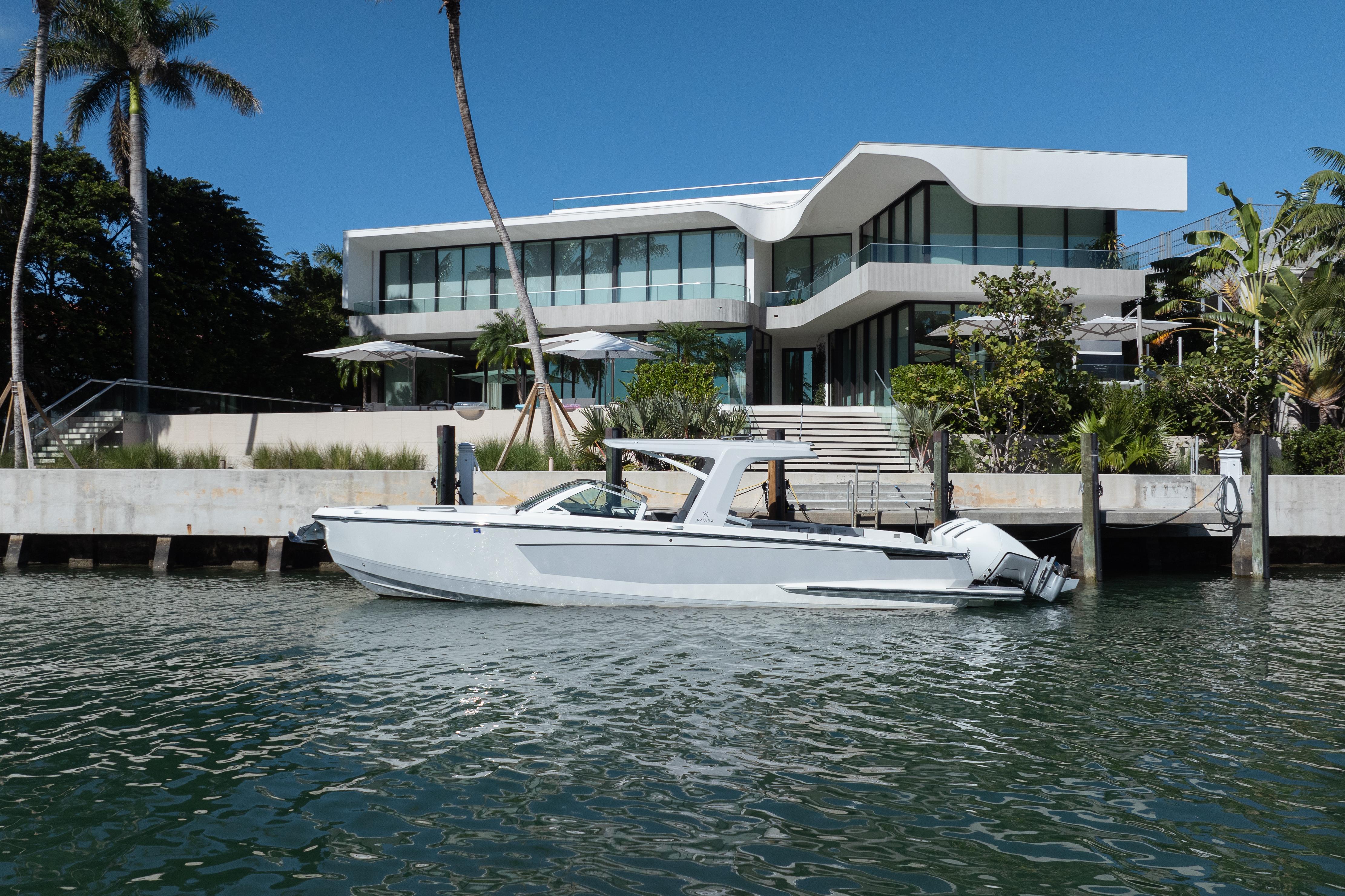Aviara-AV36 OB 2023-Pellicano FL-US-2023 Aviara AV36 OB boat docked by modern waterfront home.-9680430 | Thumbnail