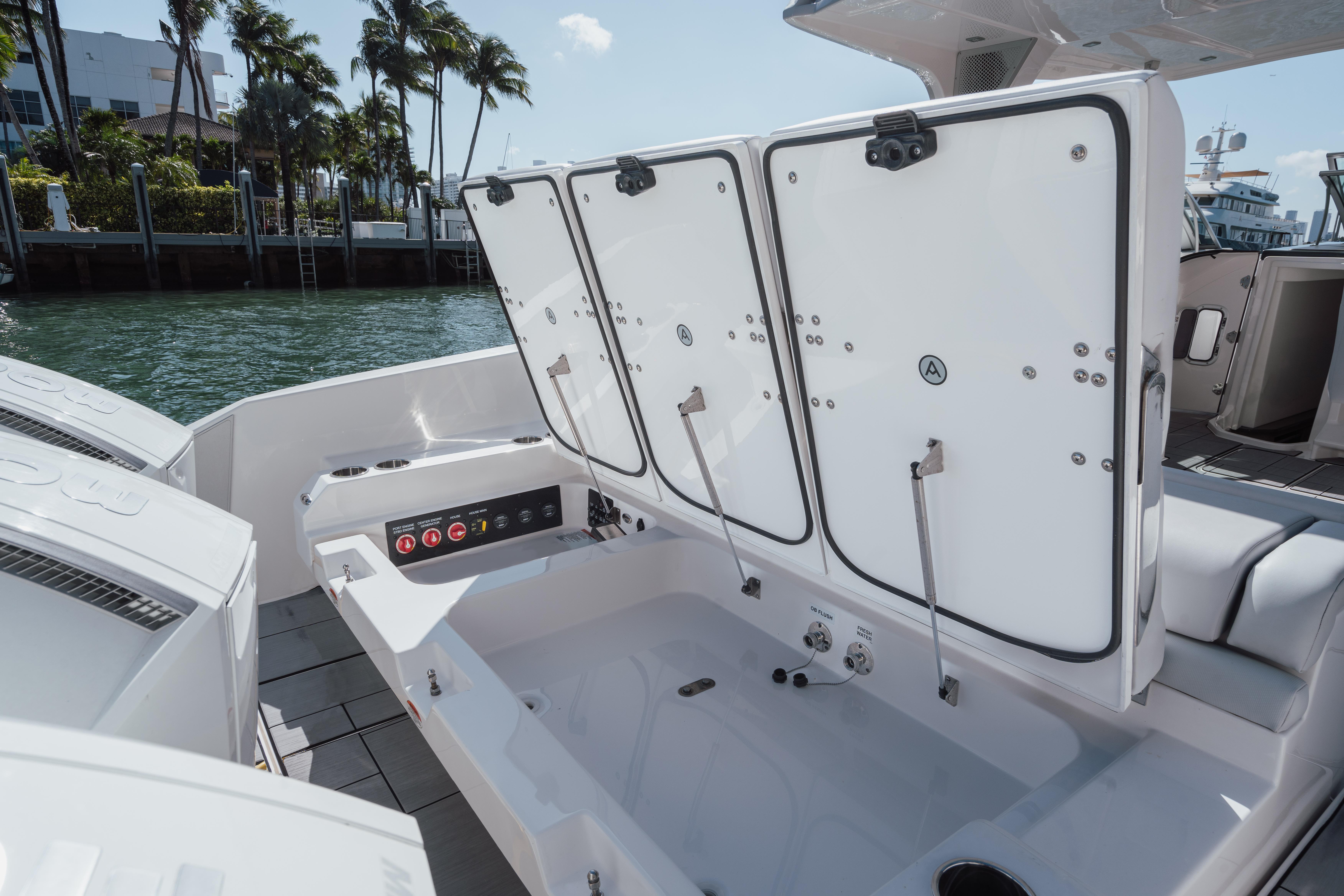 Aviara-AV36 OB 2023-Pellicano FL-US-2023 Aviara AV36 OB boat storage compartments open by the water.-9680430 | Thumbnail