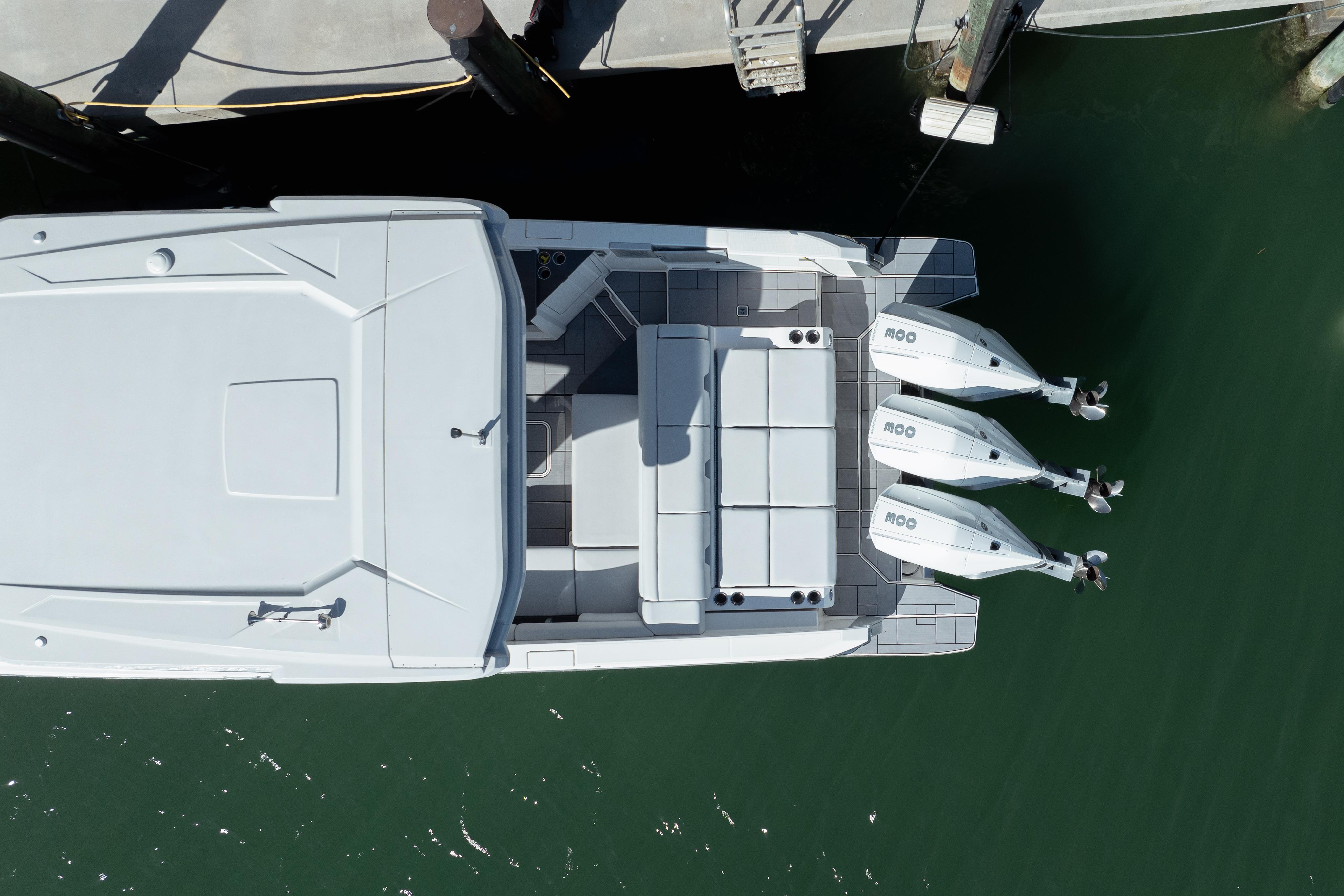 Aviara-AV36 OB 2023-Pellicano FL-US-Aerial view of 2023 Aviara AV36 OB boat docked with triple outboard engines.-9680430 | Thumbnail