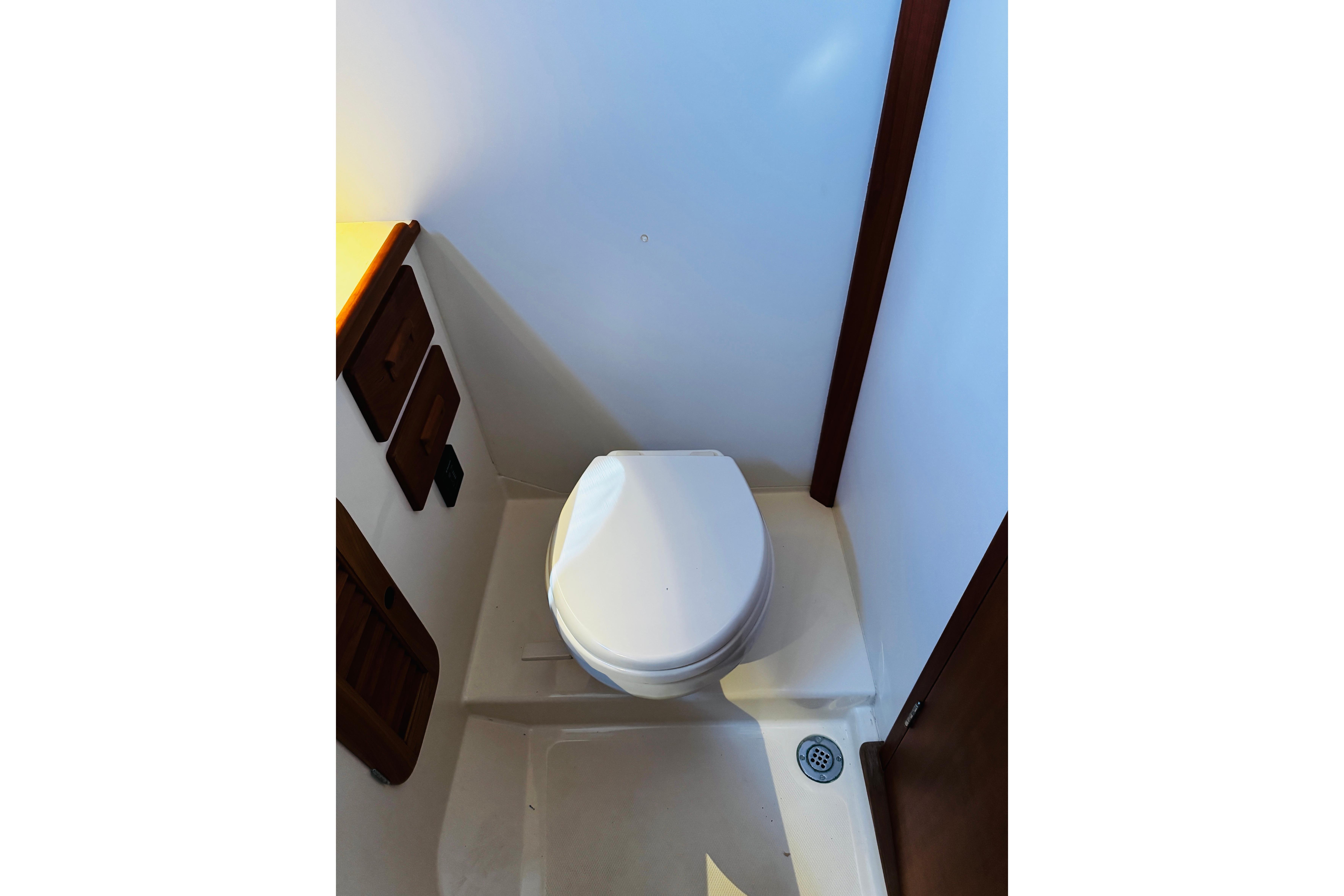 Hinckley Picnic Boat MKIII 2012 interior showing compact marine toilet setup.