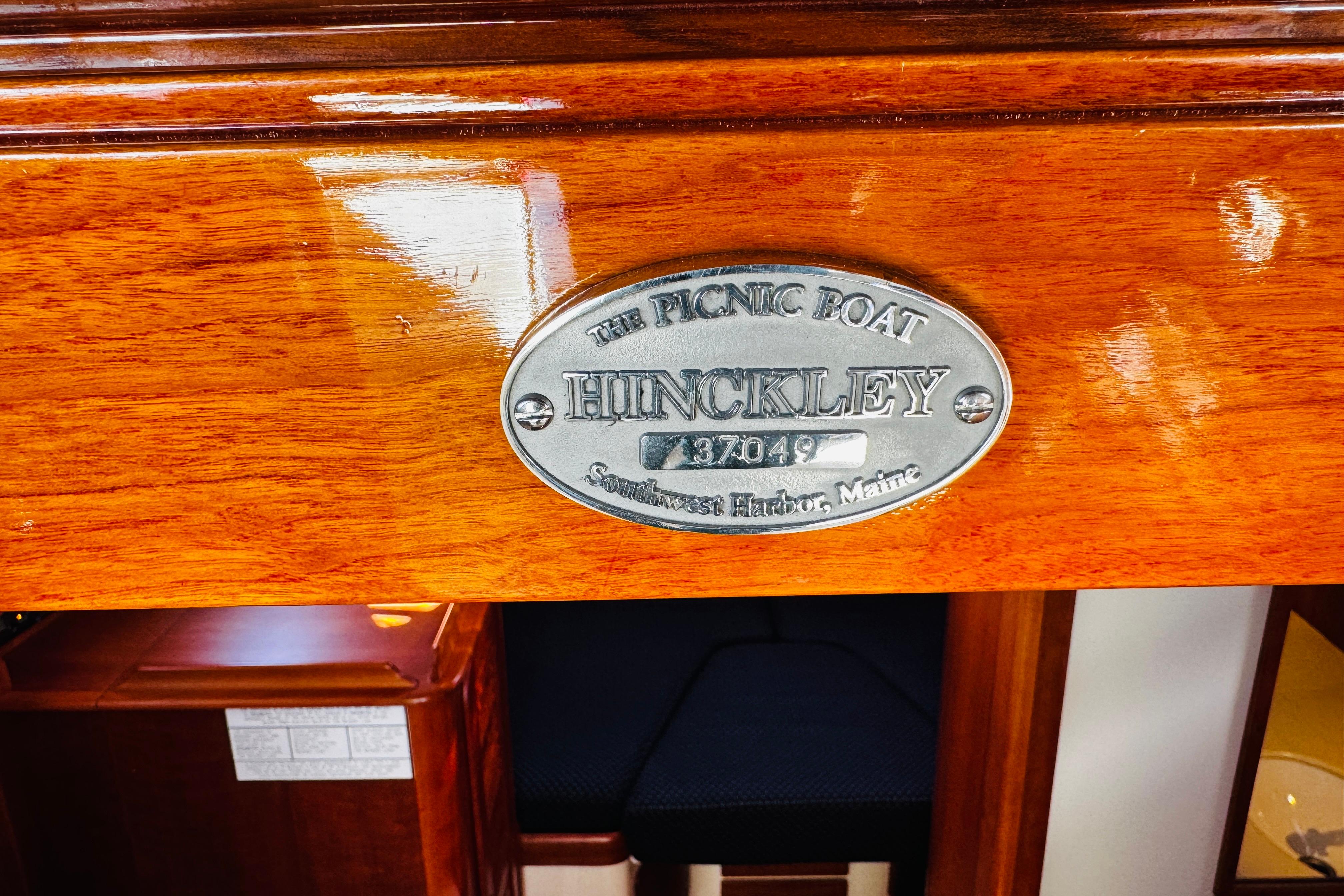 Hinckley Picnic Boat MKIII 2012 nameplate on polished wood surface, Southwest Harbor, Maine.