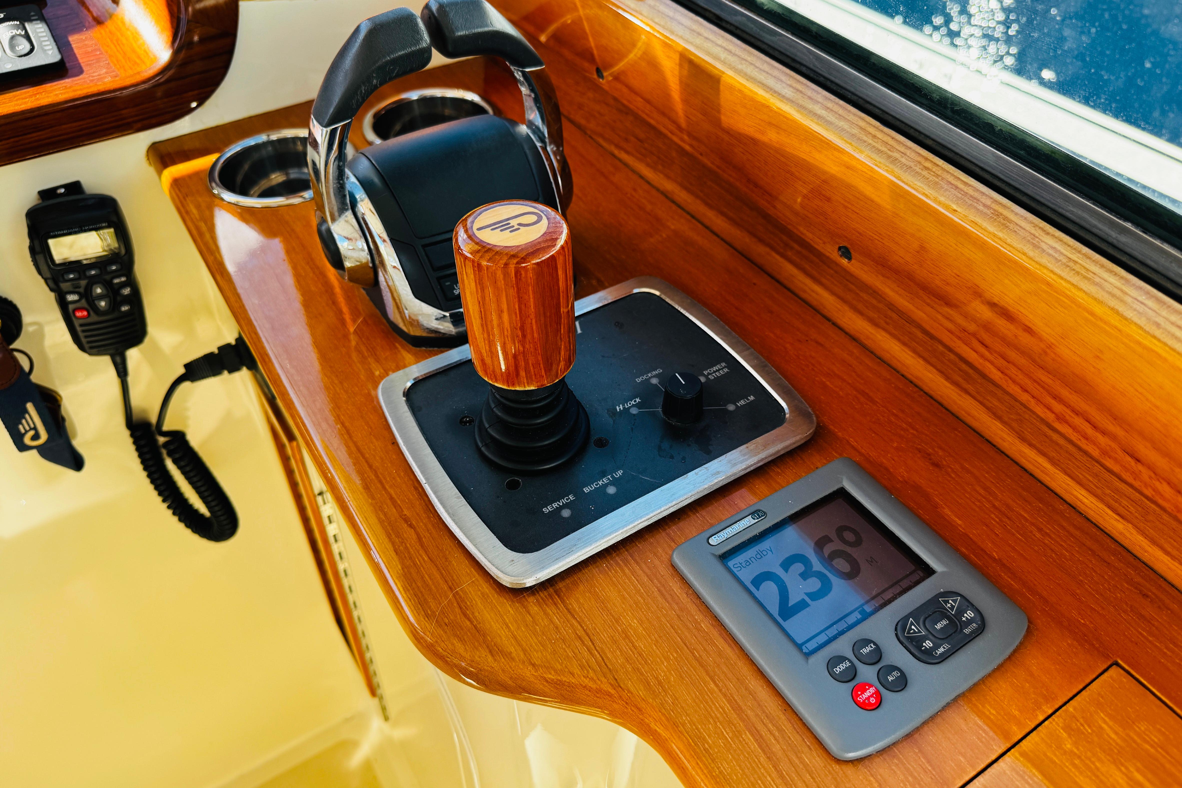 Control panel of 2012 Hinckley Picnic Boat MKIII with joystick and display.