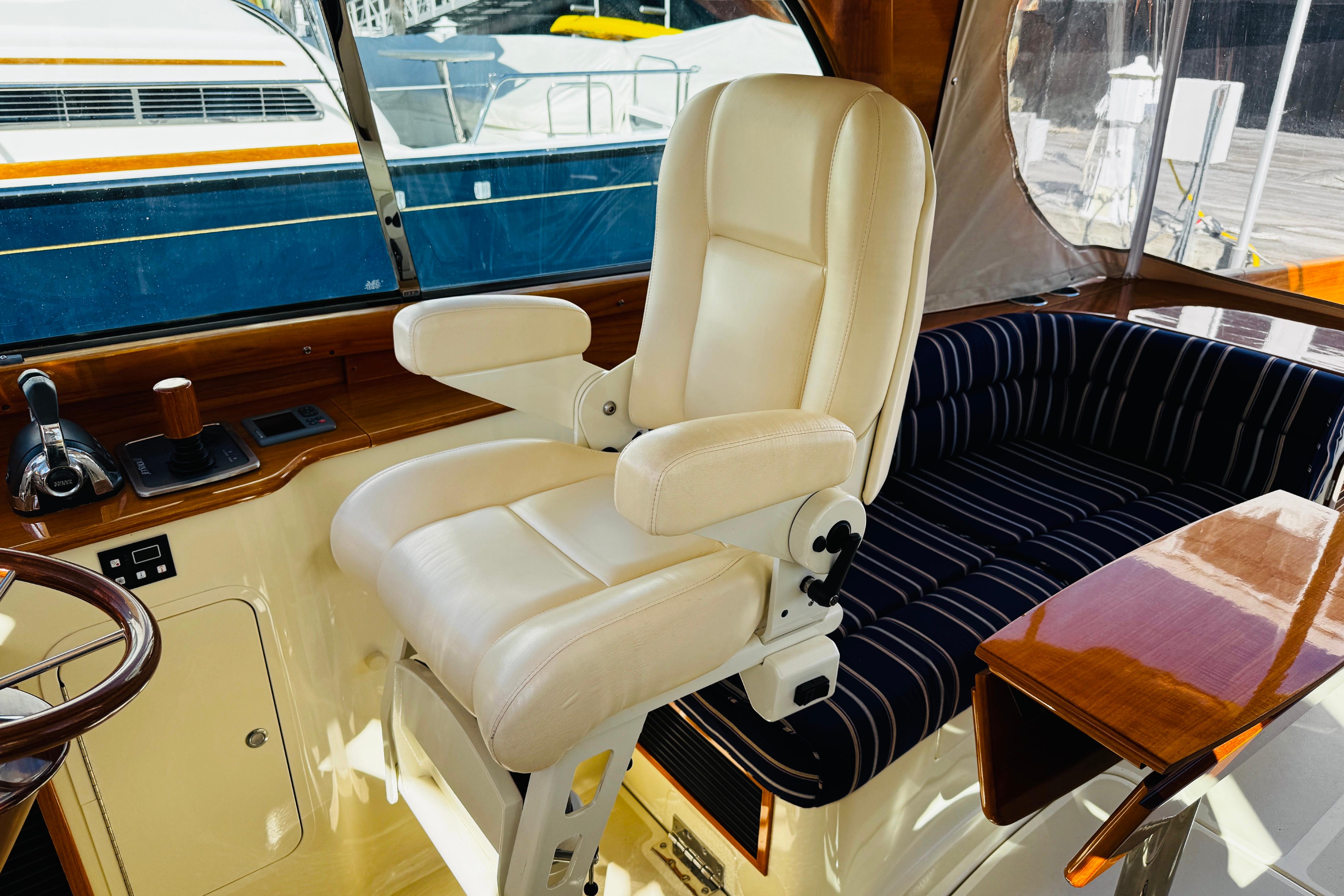 Luxurious helm seat and controls in 2012 Hinckley Picnic Boat MKIII.