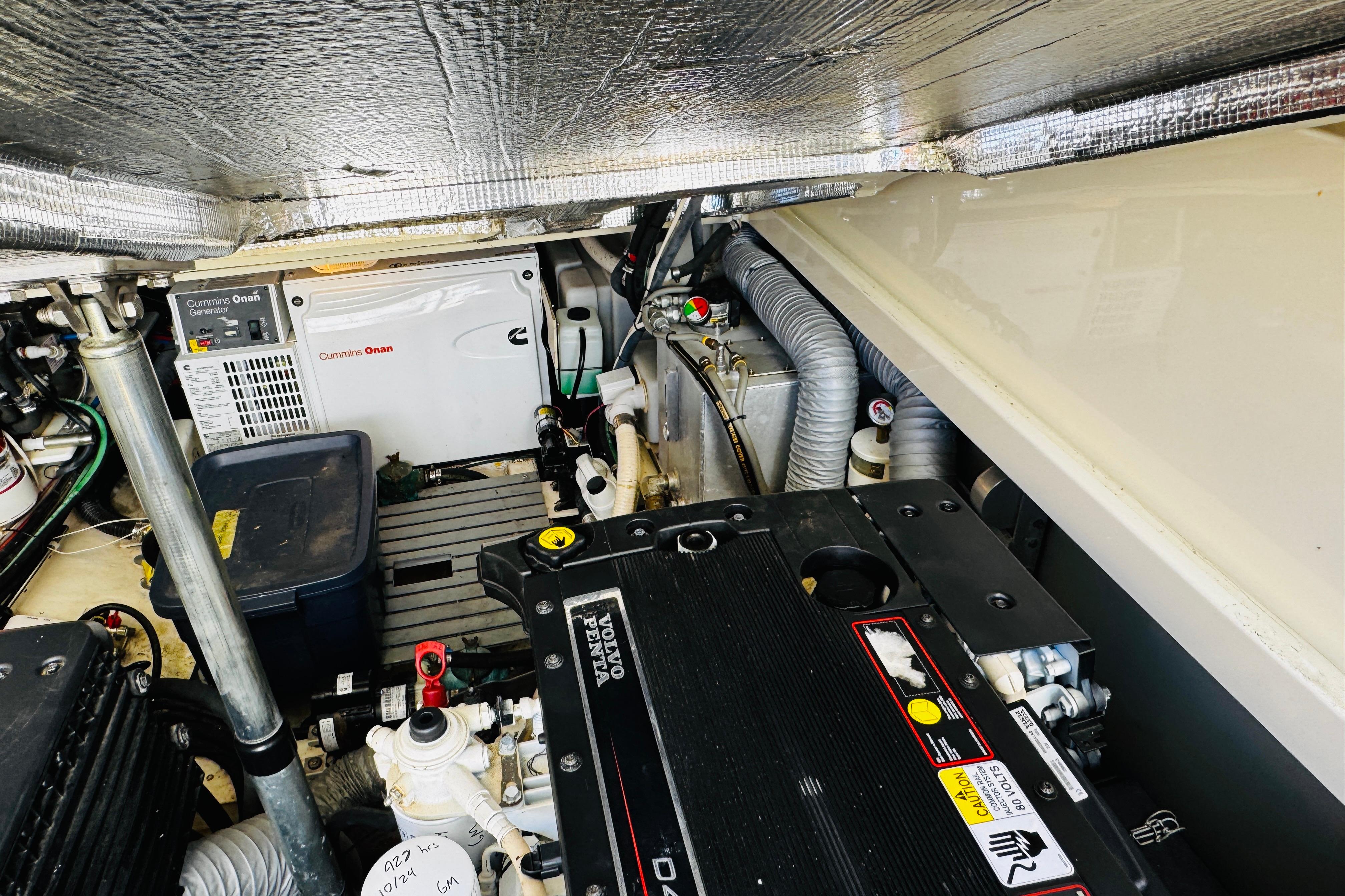 Engine room of 2012 Hinckley Picnic Boat MKIII with Cummins Onan generator and Yanmar engine.