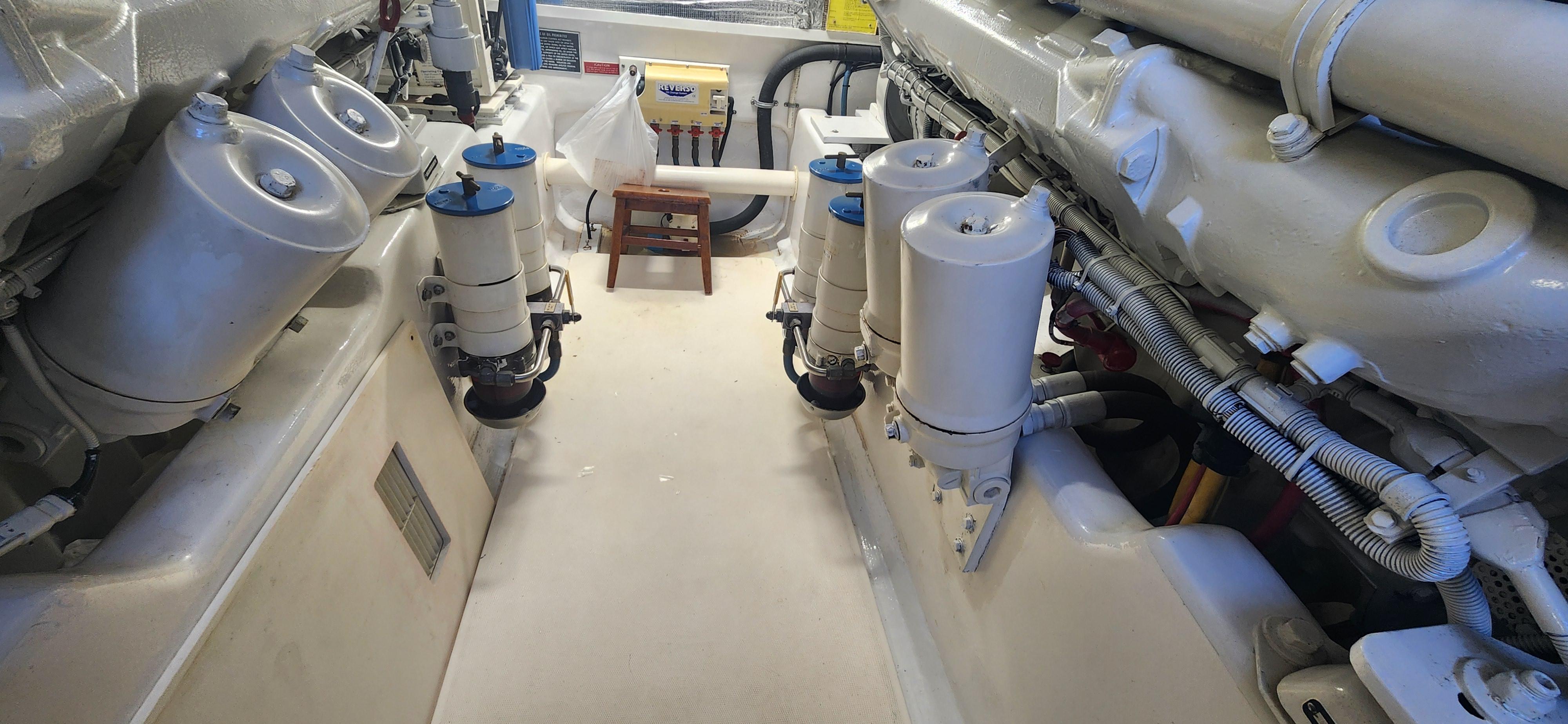 Cabo-48 Convertible 2004-Laura K AL-US-Engine room of 2004 Cabo 48 Convertible yacht, showcasing mechanical components and systems.-9710440 | Thumbnail
