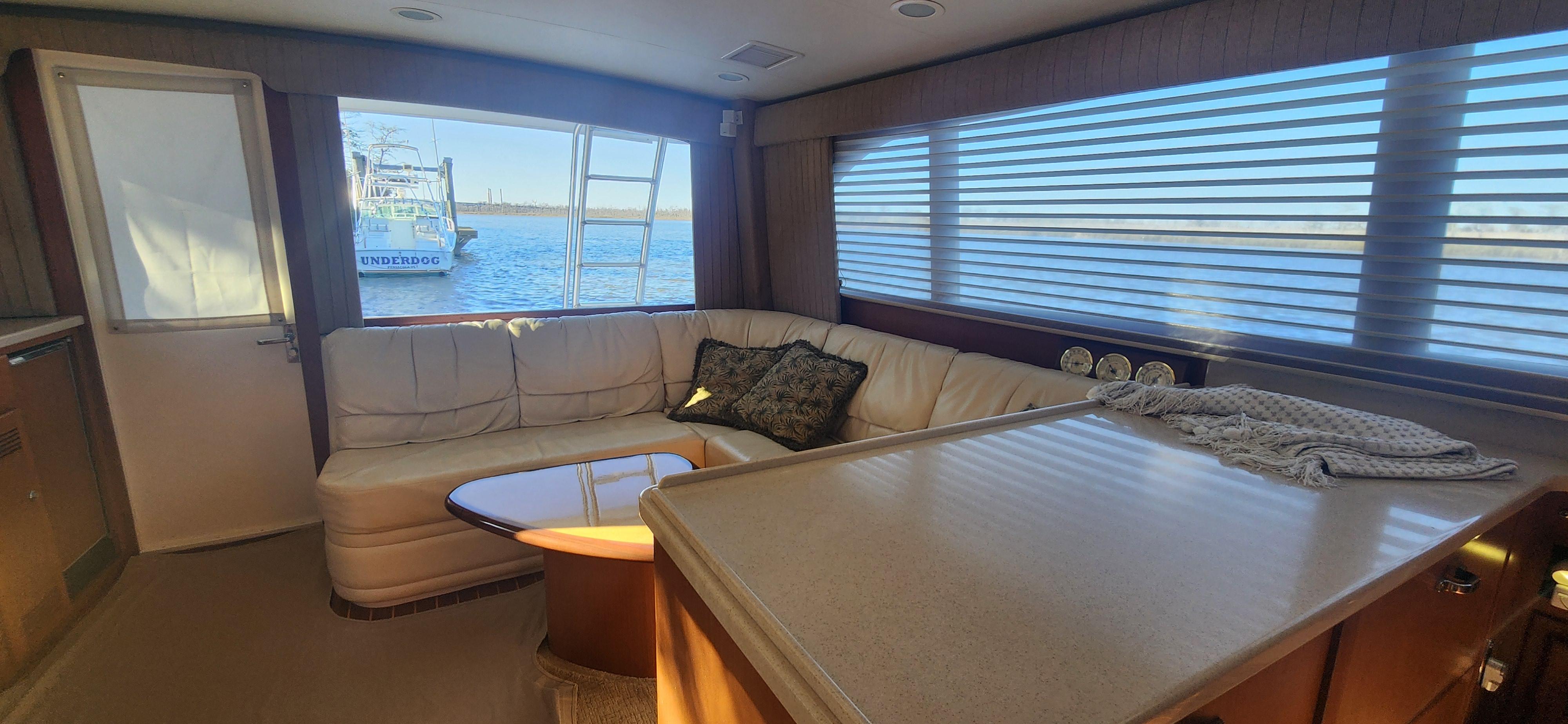 Cabo-48 Convertible 2004-Laura K AL-US-Luxurious interior of a 2004 Cabo 48 Convertible yacht with plush seating and ocean view.-9710440 | Thumbnail