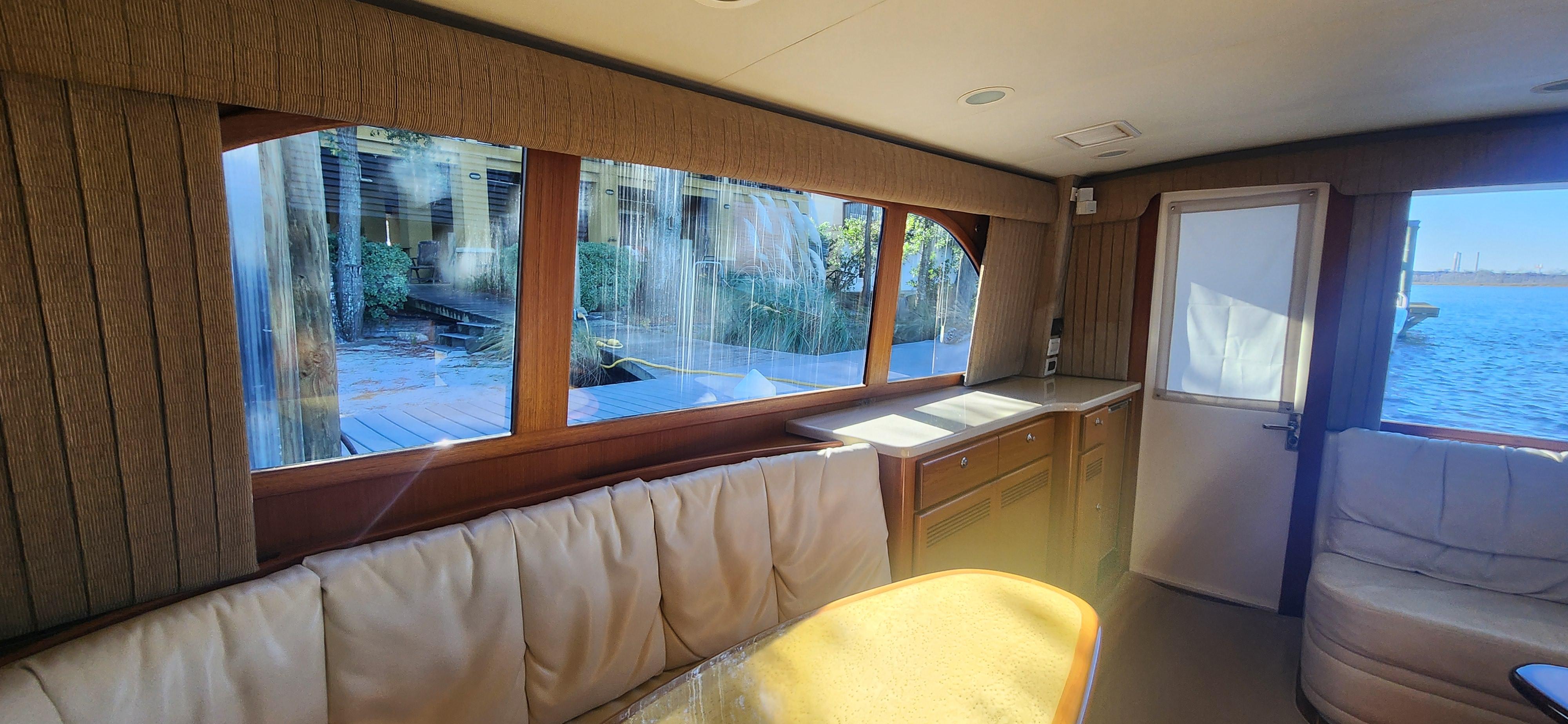 Cabo-48 Convertible 2004-Laura K AL-US-Interior of 2004 Cabo 48 Convertible yacht with large windows and comfortable seating.-9710440 | Thumbnail