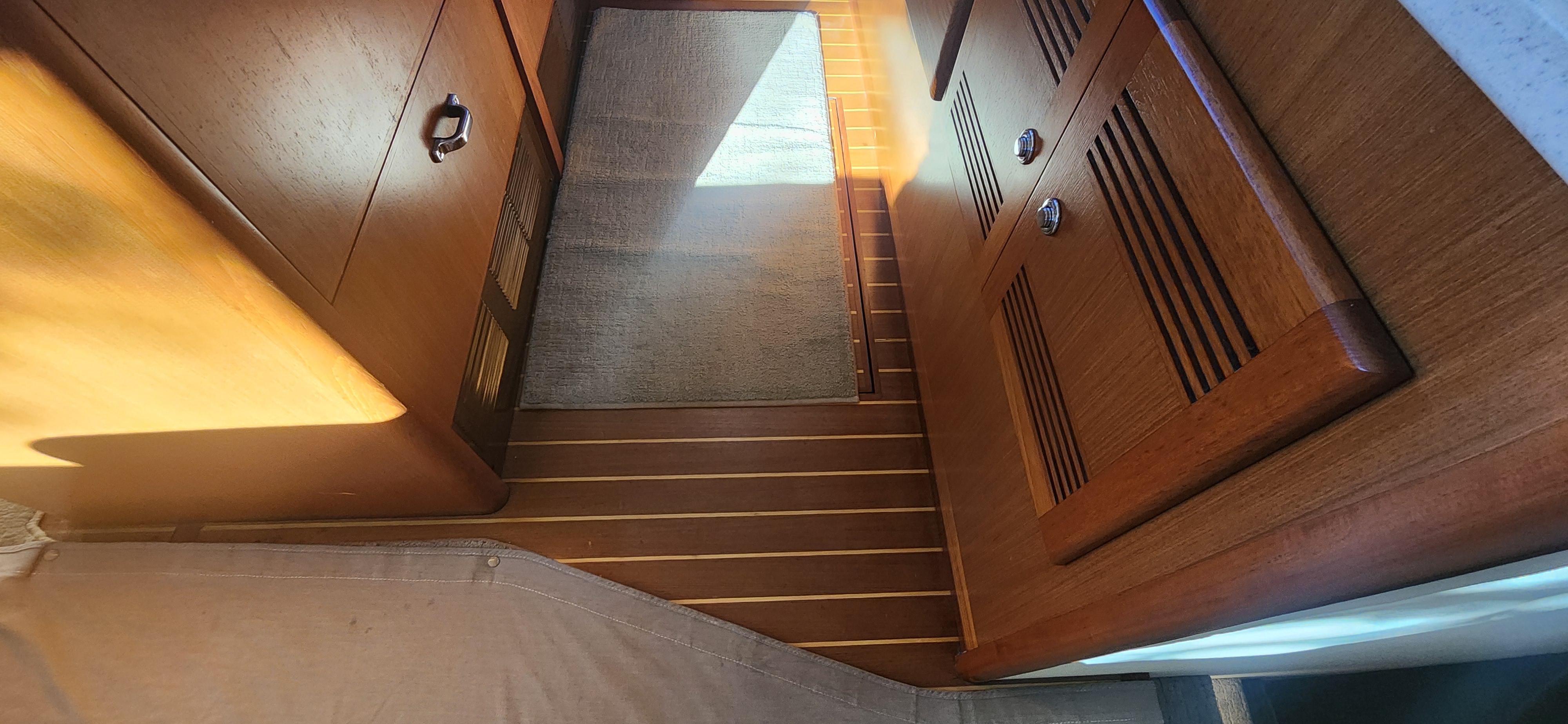 Cabo-48 Convertible 2004-Laura K AL-US-Interior of 2004 Cabo 48 Convertible yacht with wooden cabinetry and flooring.-9710440 | Thumbnail