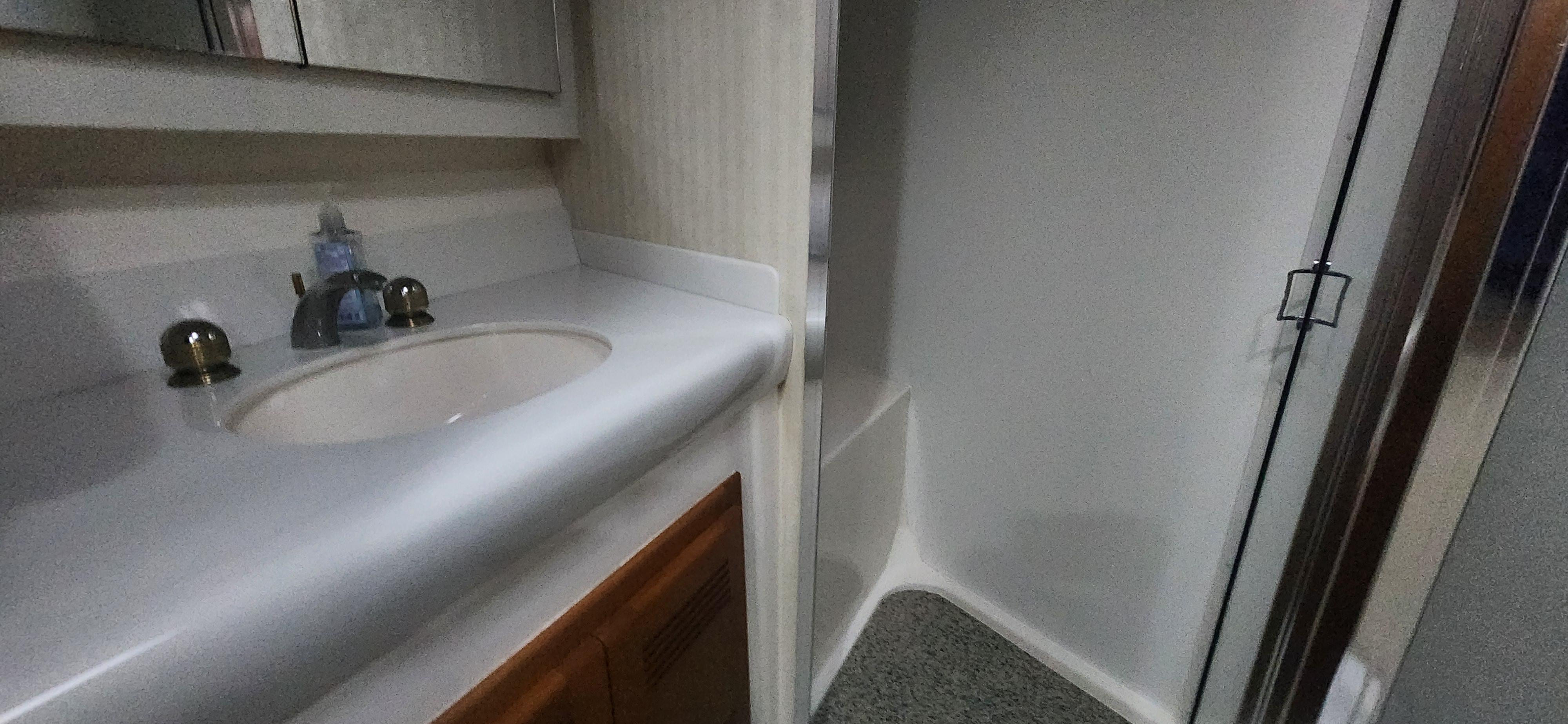 Cabo-48 Convertible 2004-Laura K AL-US-2004 Cabo 48 Convertible yacht bathroom with sink and shower.-9710440 | Thumbnail