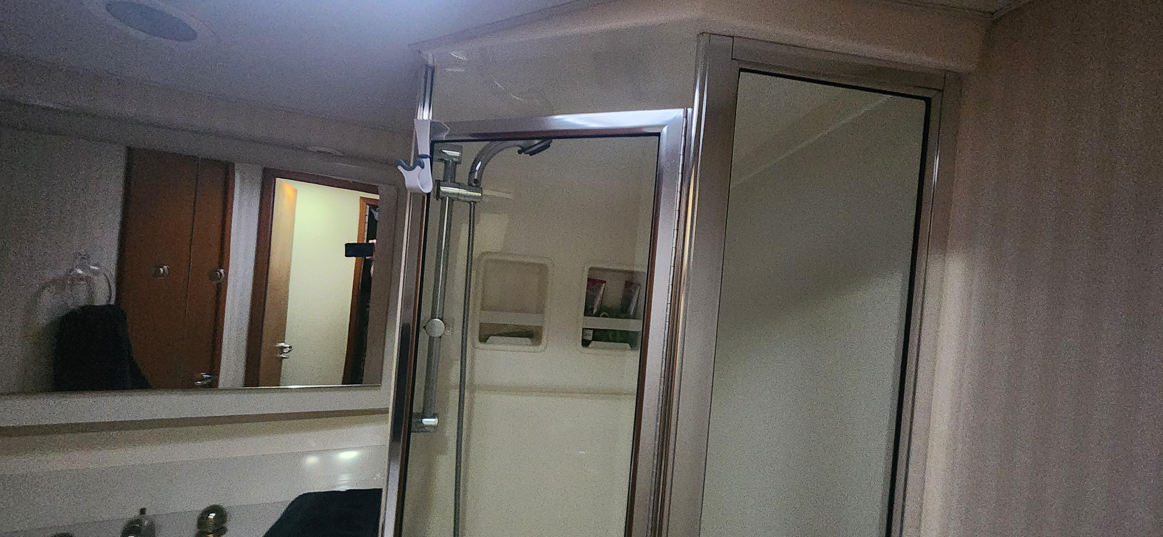 Cabo-48 Convertible 2004-Laura K AL-US-Bathroom interior of 2004 Cabo 48 Convertible yacht with shower and mirror.-9710440 | Thumbnail