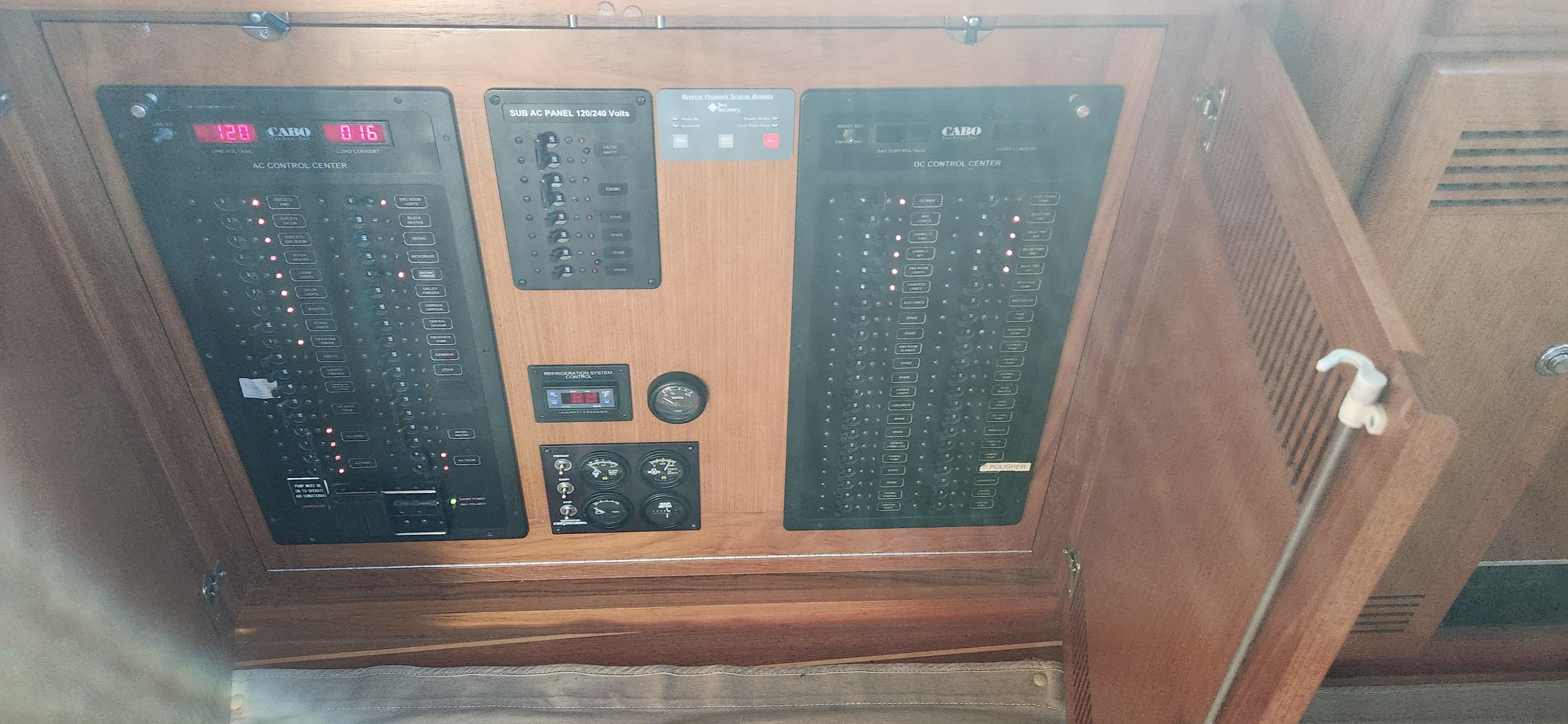 Cabo-48 Convertible 2004-Laura K AL-US-Electrical panel inside a 2004 Cabo 48 Convertible yacht.-9710440 | Thumbnail