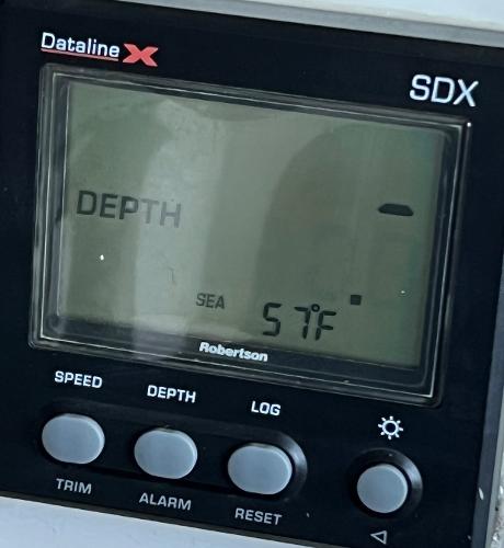 Depth gauge display on a 1997 Carver 350 Mariner, showing sea temperature at 57°F.