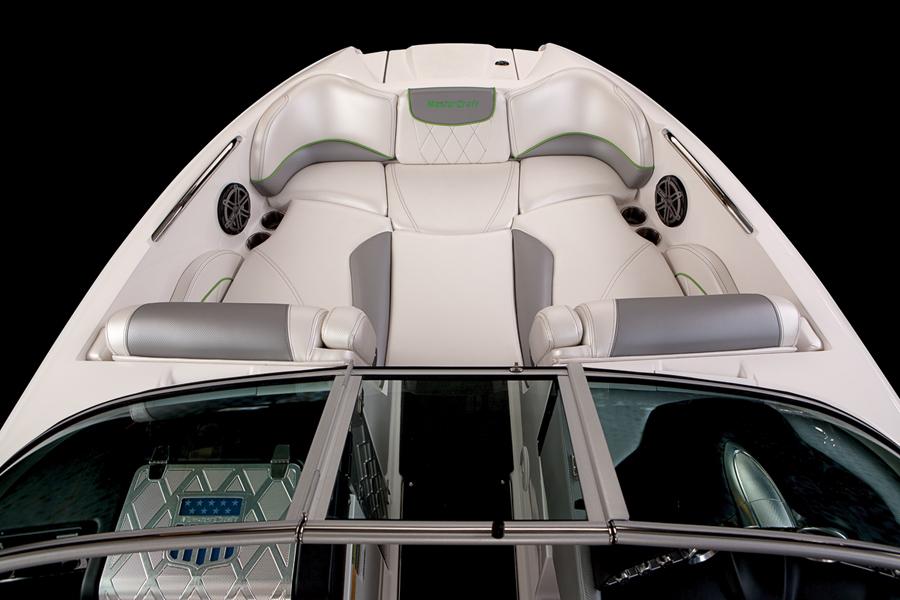 2013 MasterCraft X-25 boat interior with white seating and speakers.
