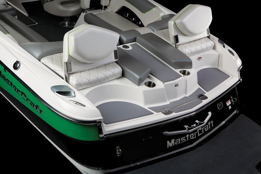 2013 MasterCraft X-25 boat interior with white and gray seating, green accents.
