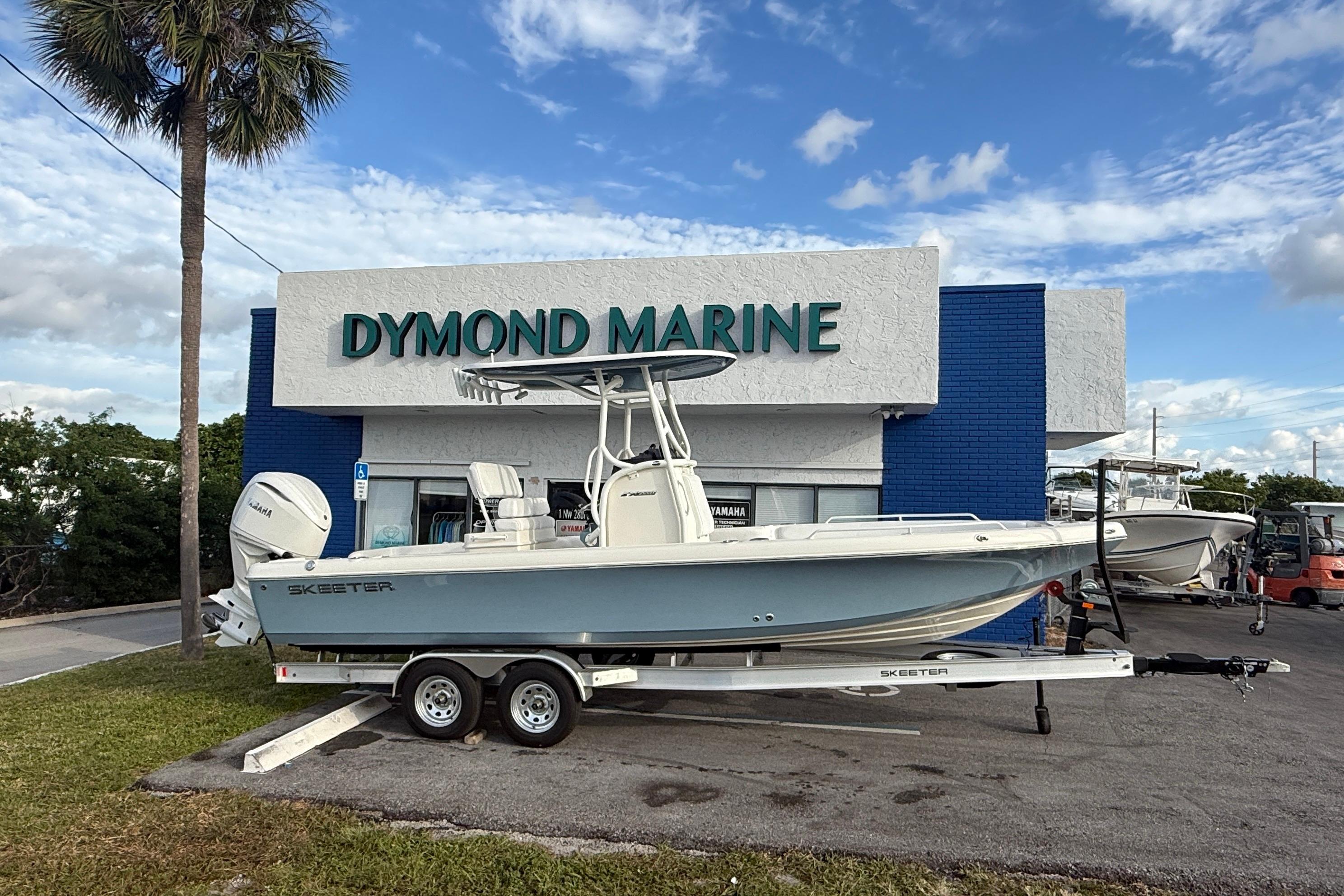 2026 Skeeter SX2550 Family boat on trailer at Dymond Marine dealership.