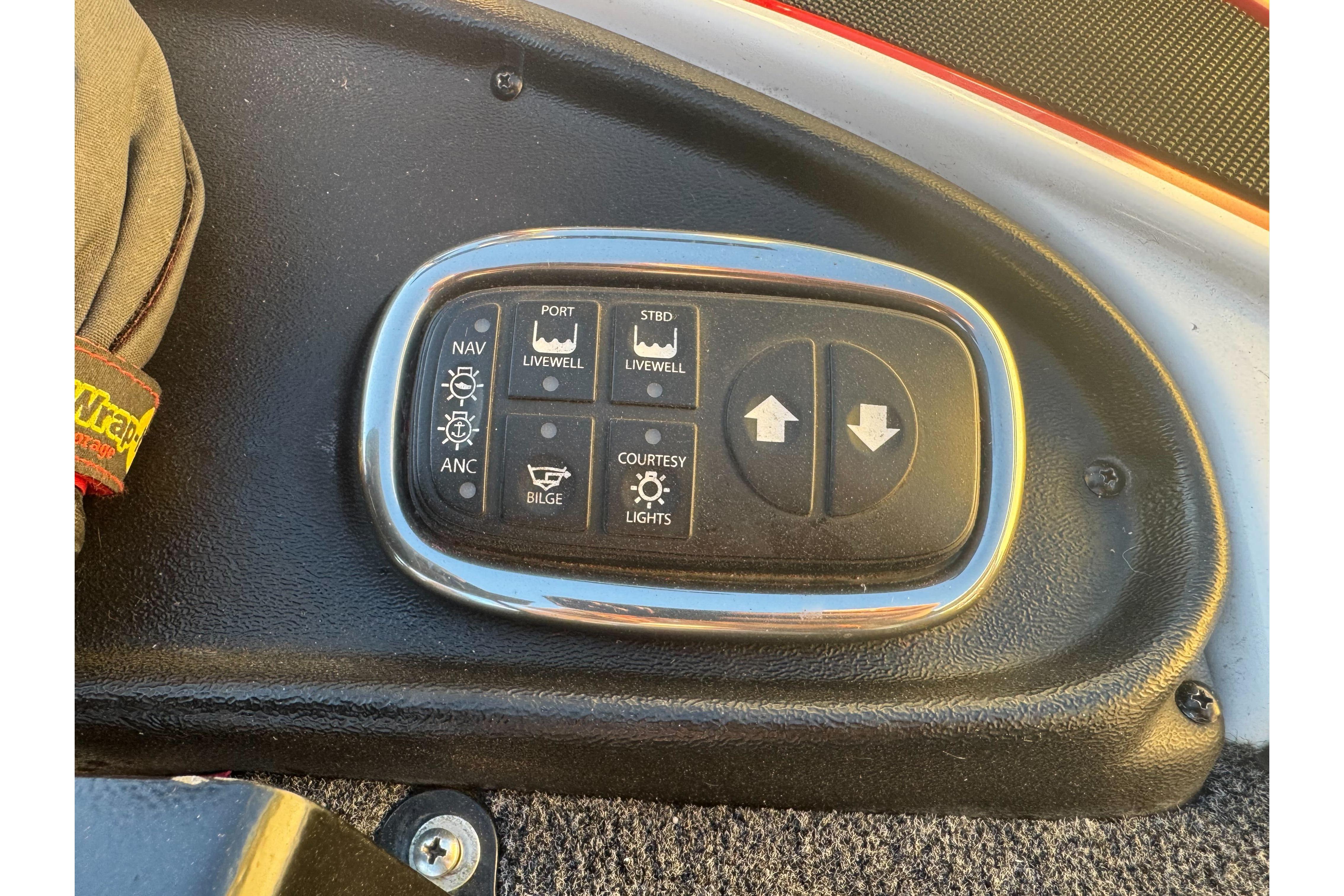 Control panel of a 2011 Nitro Z-9 DC boat with various switches.