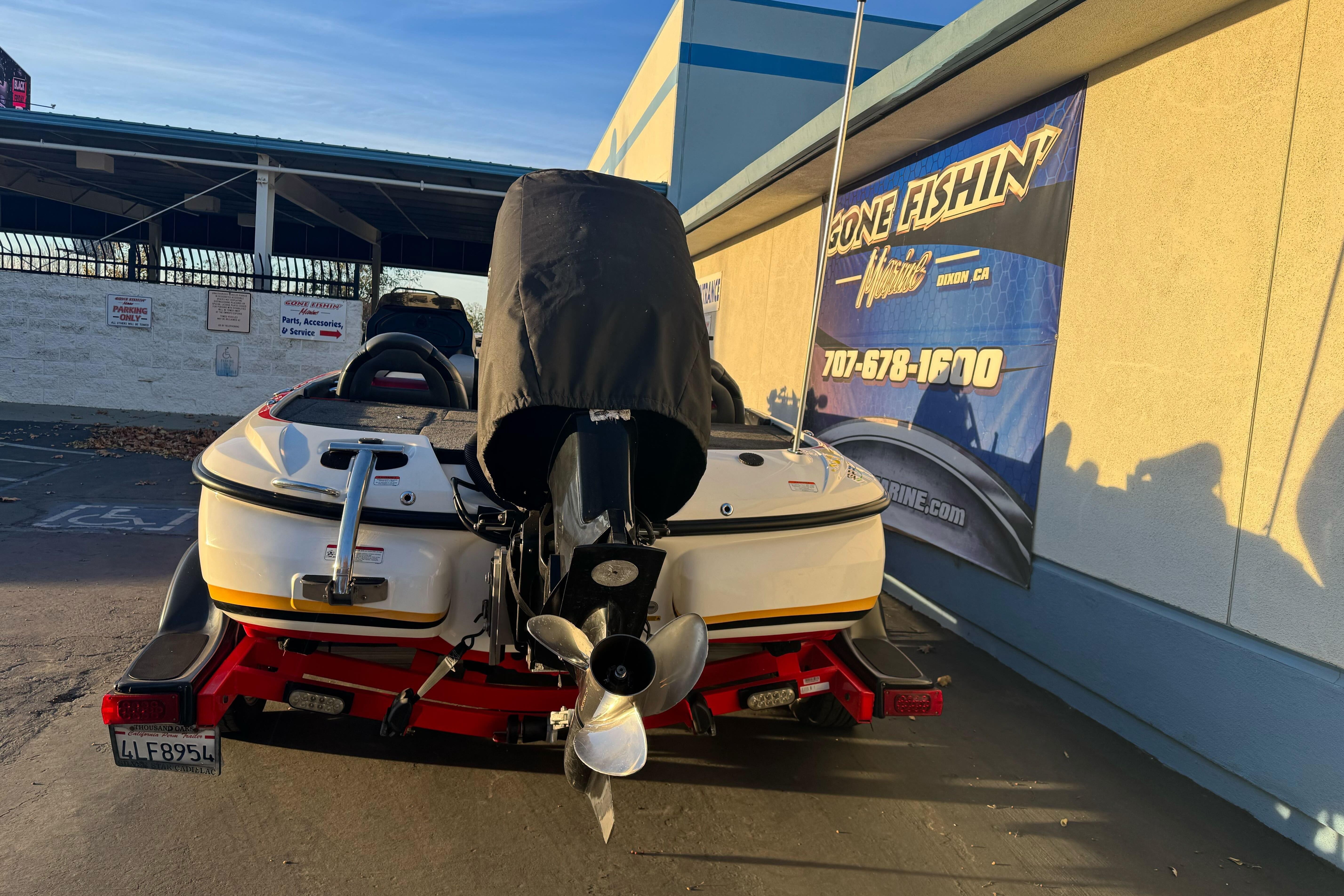 2011 Nitro Z-9 DC boat on trailer, parked near a marine service center.