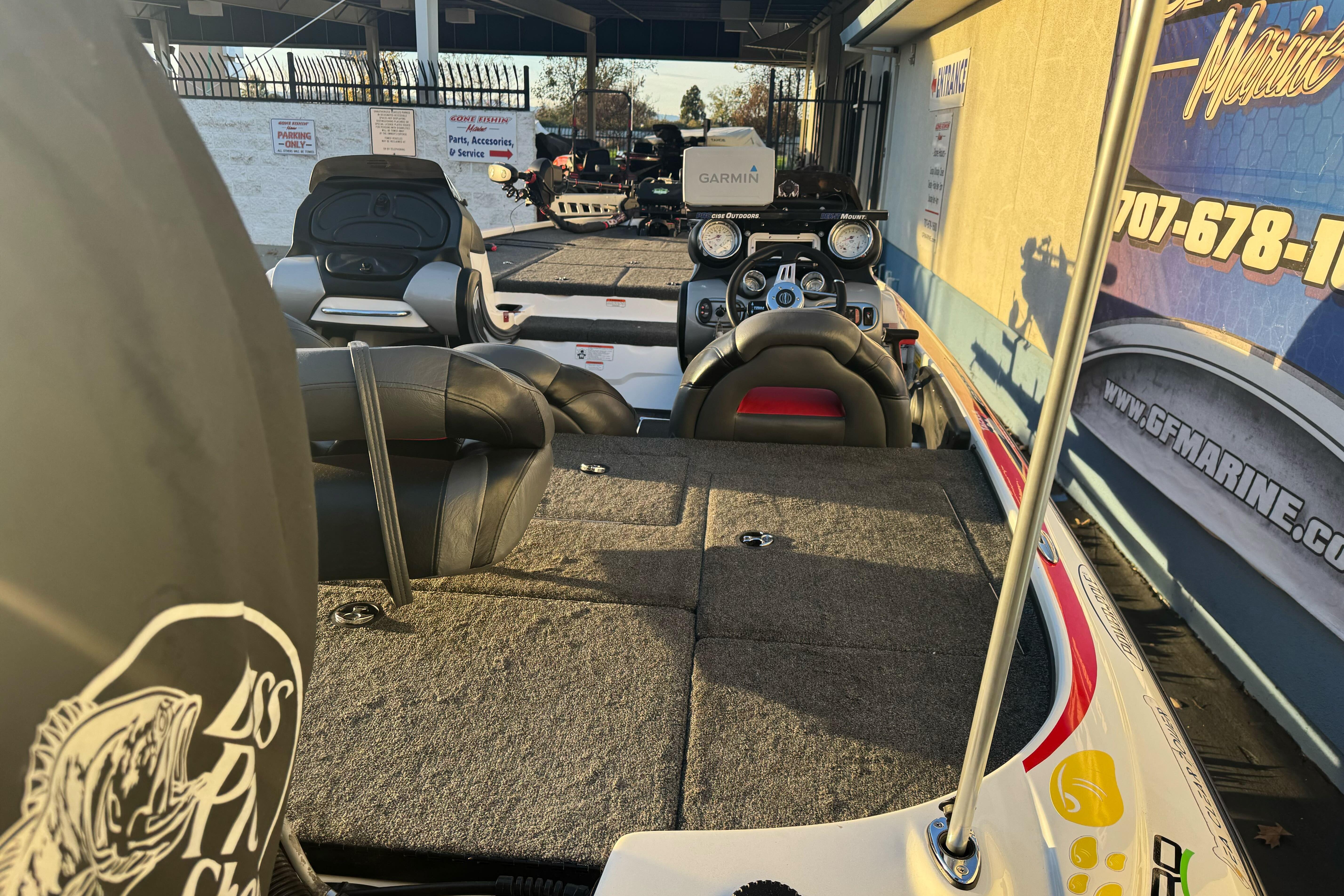 2011 Nitro Z-9 DC boat interior with seating and control panel, displayed at a marine dealership.