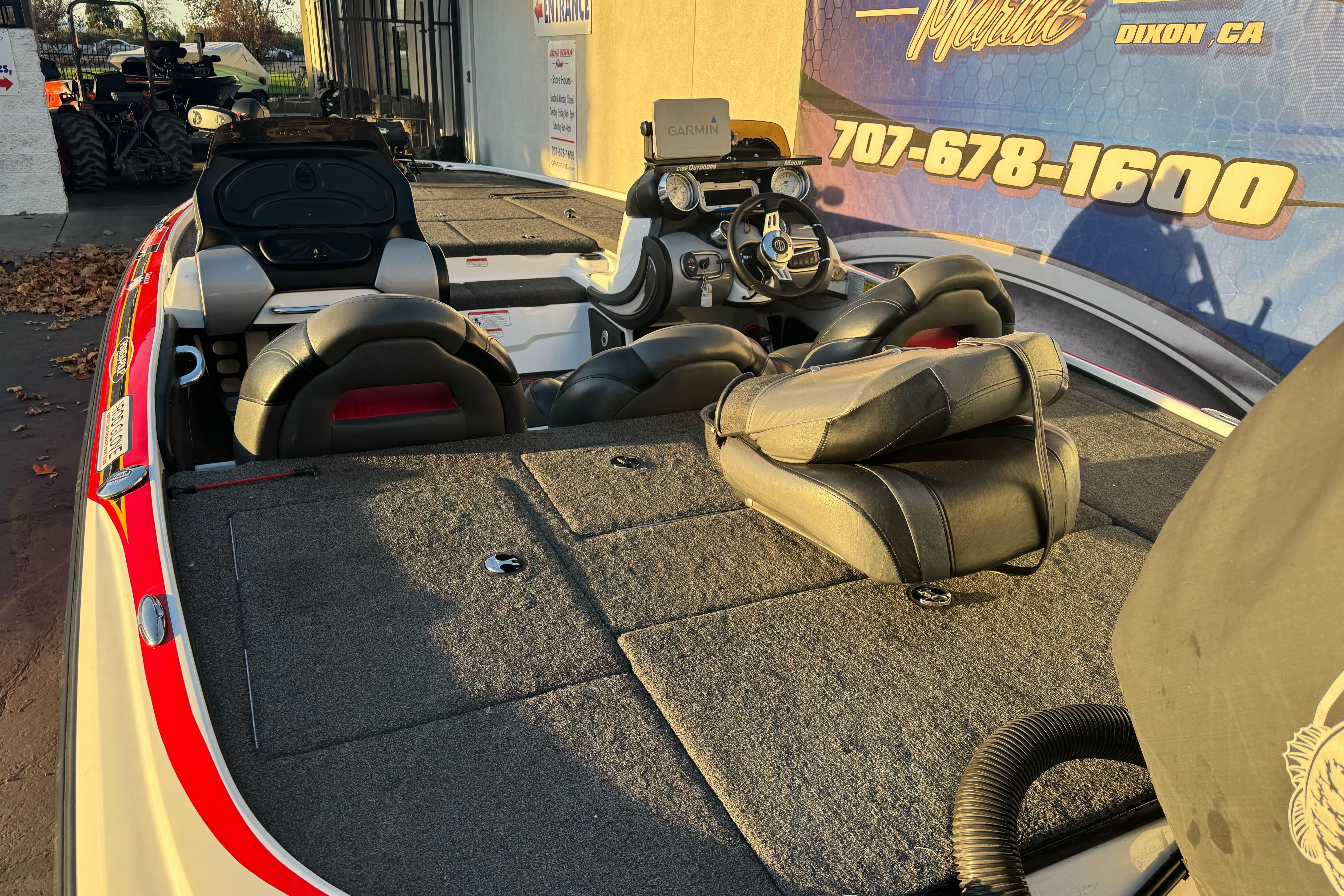 2011 Nitro Z-9 DC boat interior with seats and steering wheel, displayed outdoors.