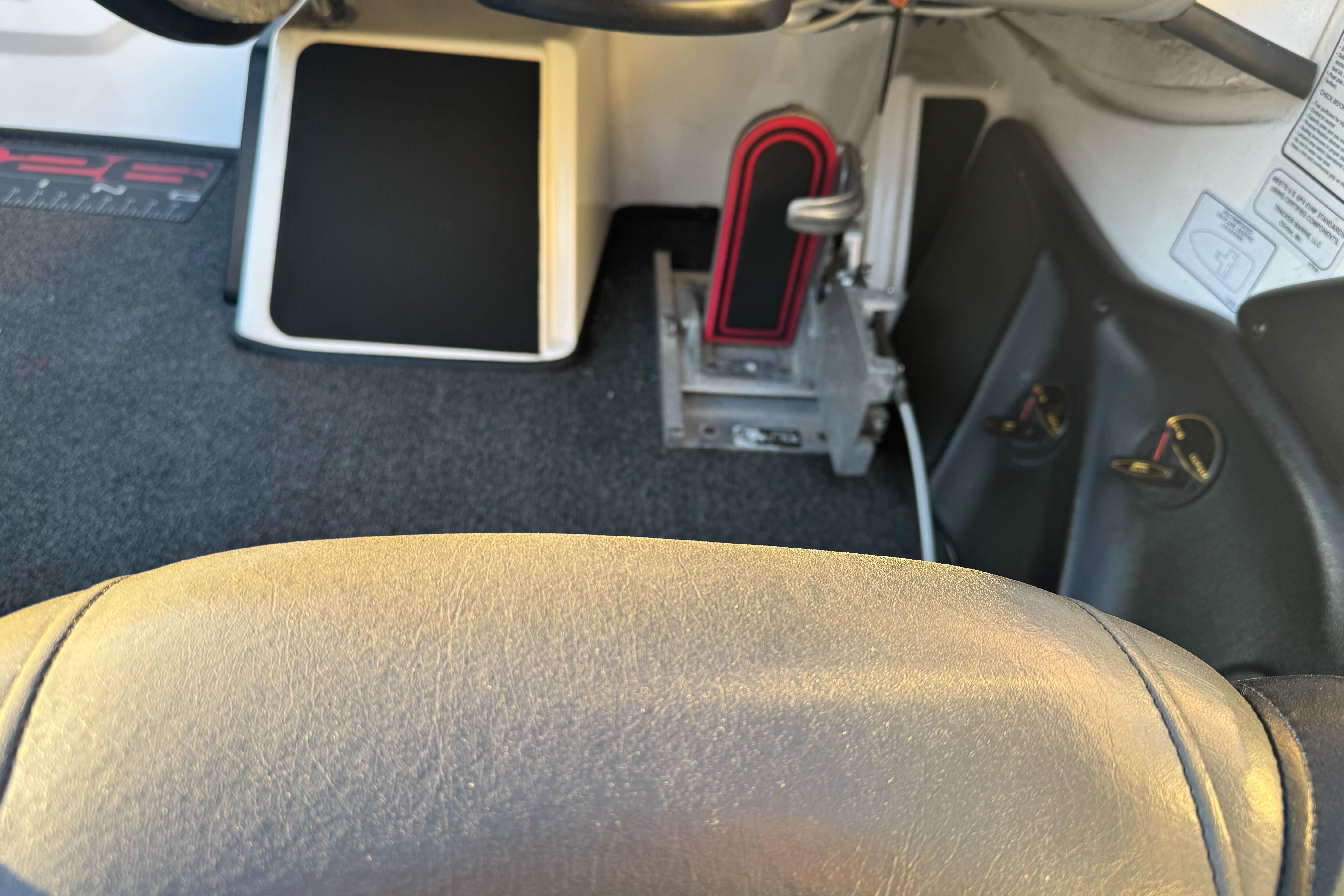 Interior view of a 2011 Nitro Z-9 DC boat, featuring steering and foot controls.