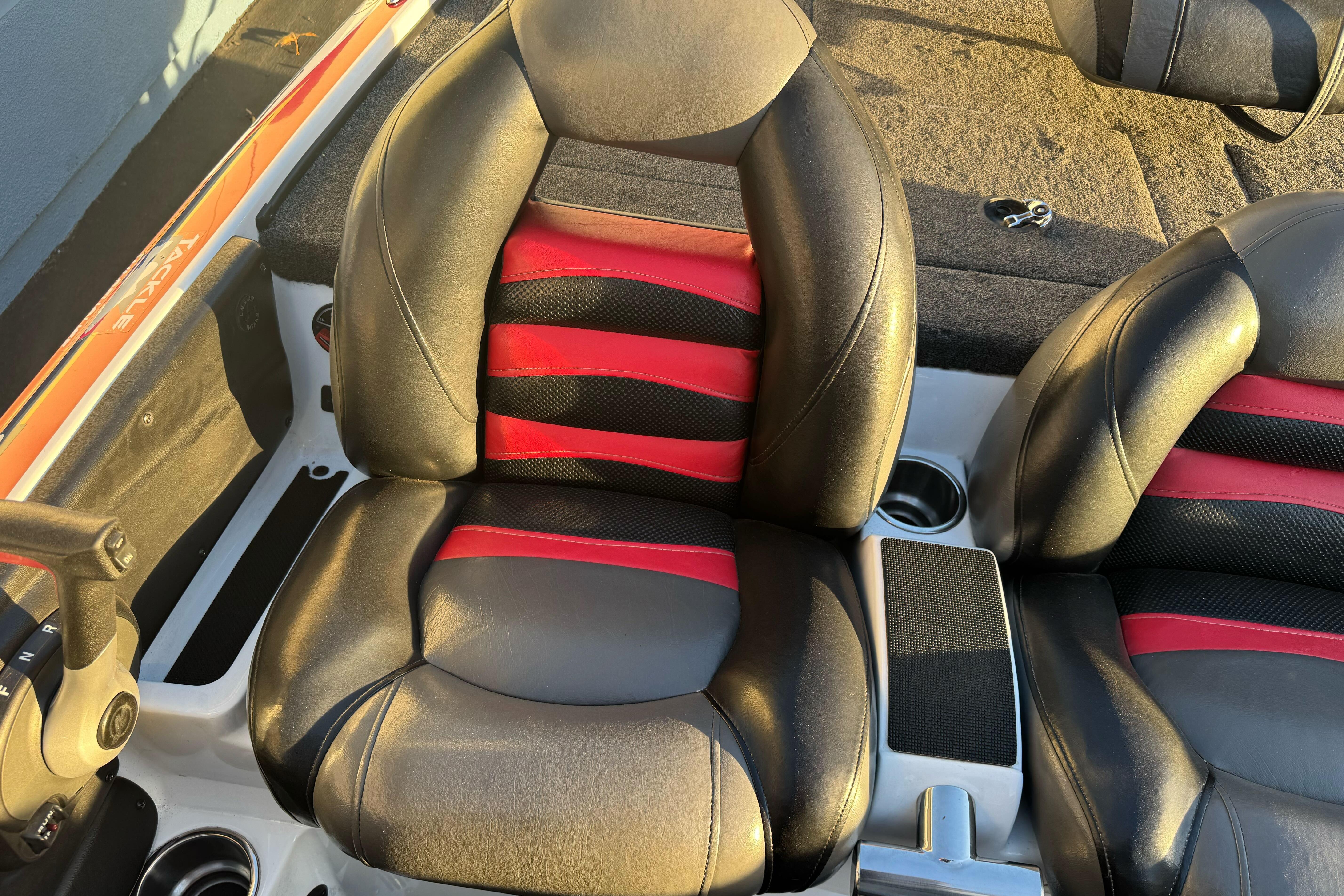 2011 Nitro Z-9 DC boat seats with black and red leather design.