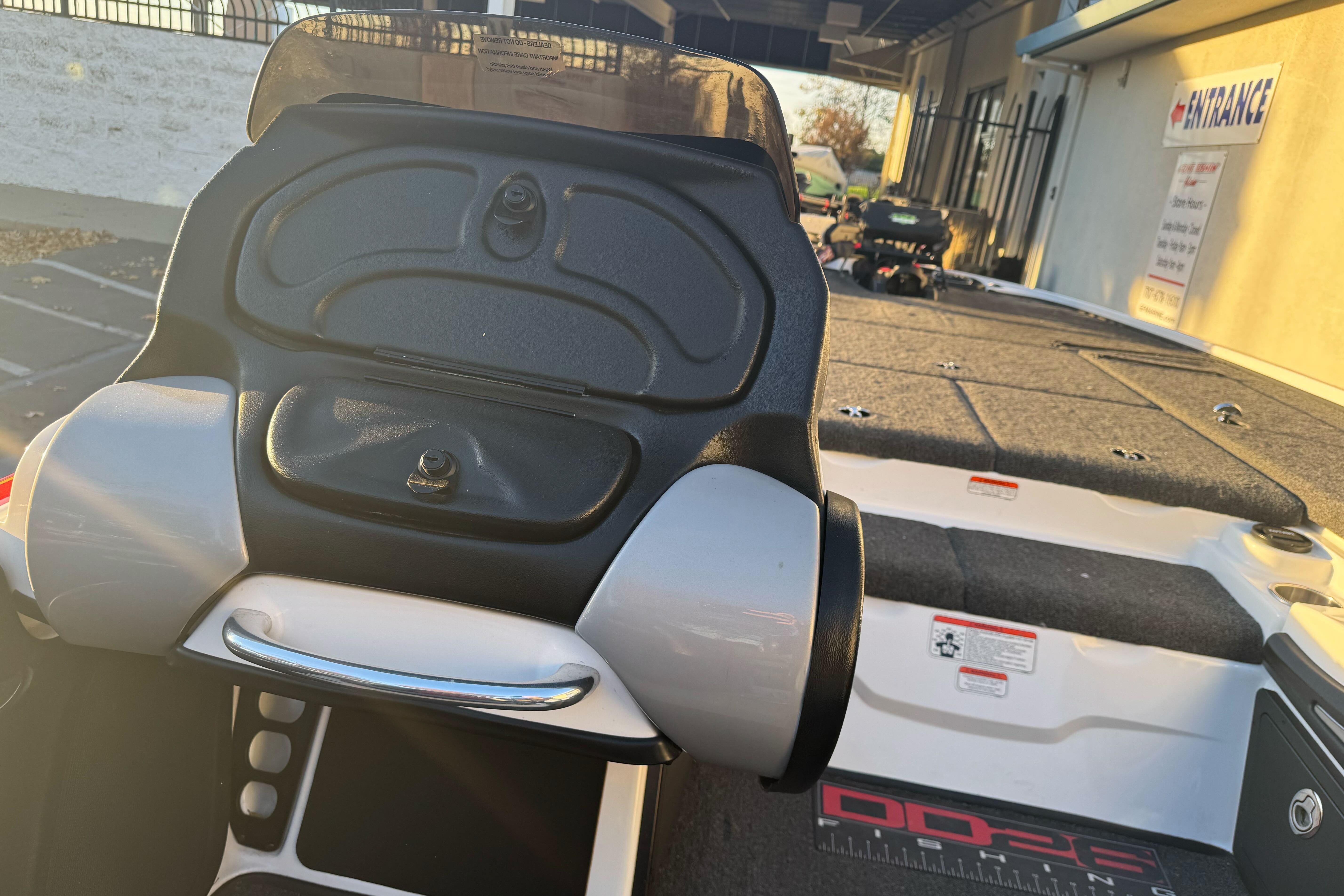 2011 Nitro Z-9 DC boat dashboard and seating area in outdoor setting.