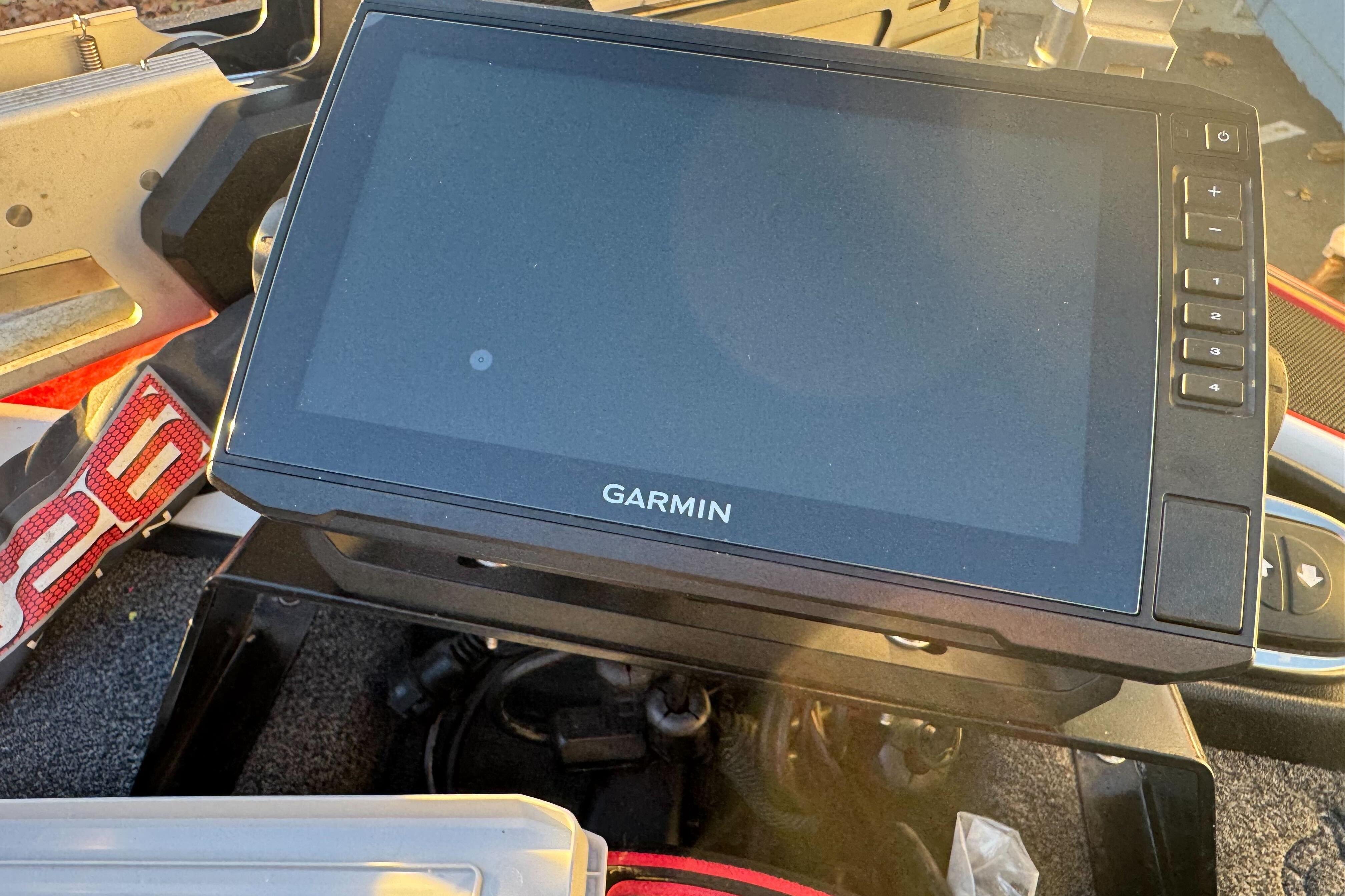 Garmin device on 2011 Nitro Z-9 DC boat dashboard, sunlight reflection.