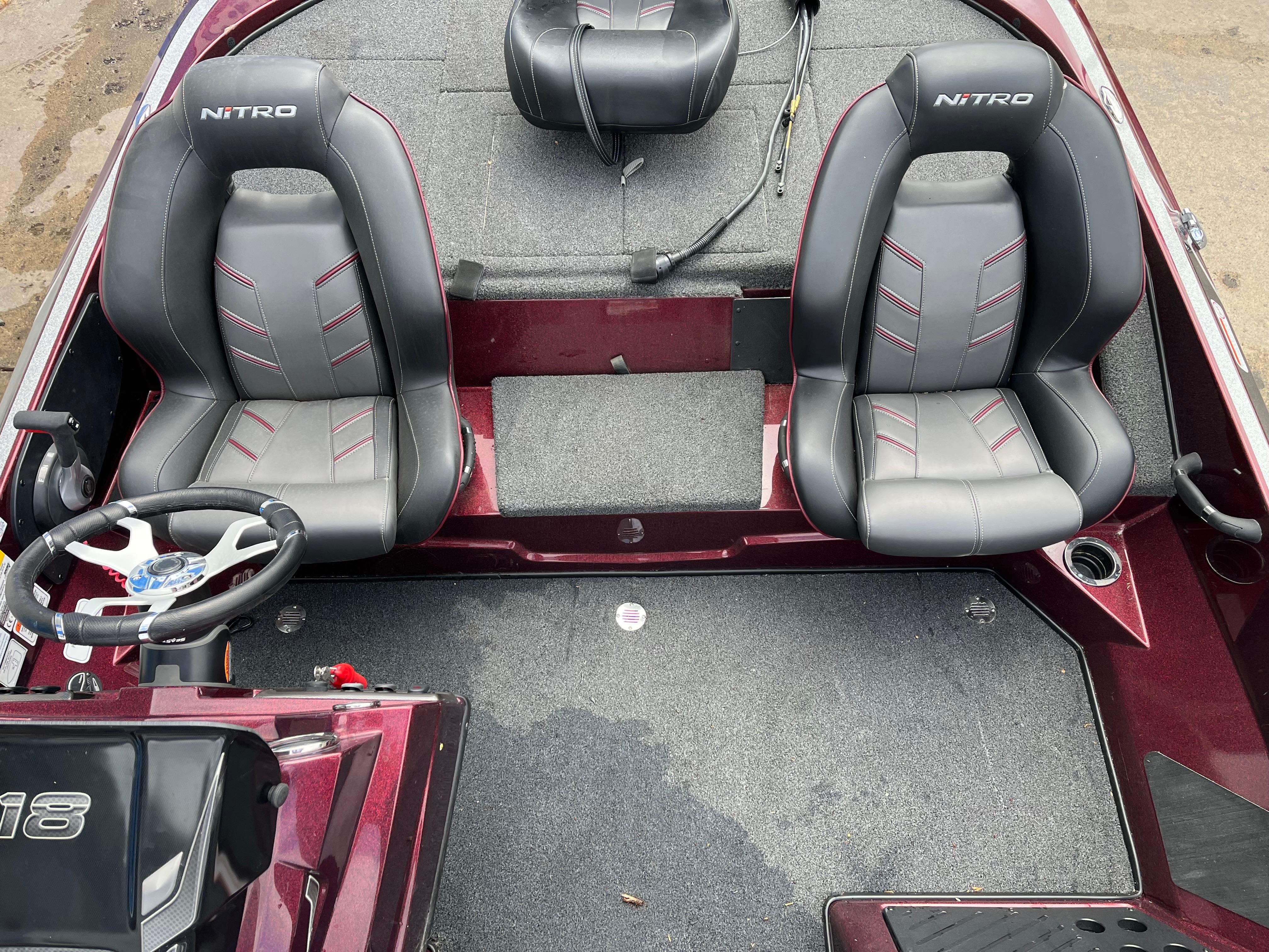 2022 Nitro Z18 boat interior with dual gray seats and steering wheel.